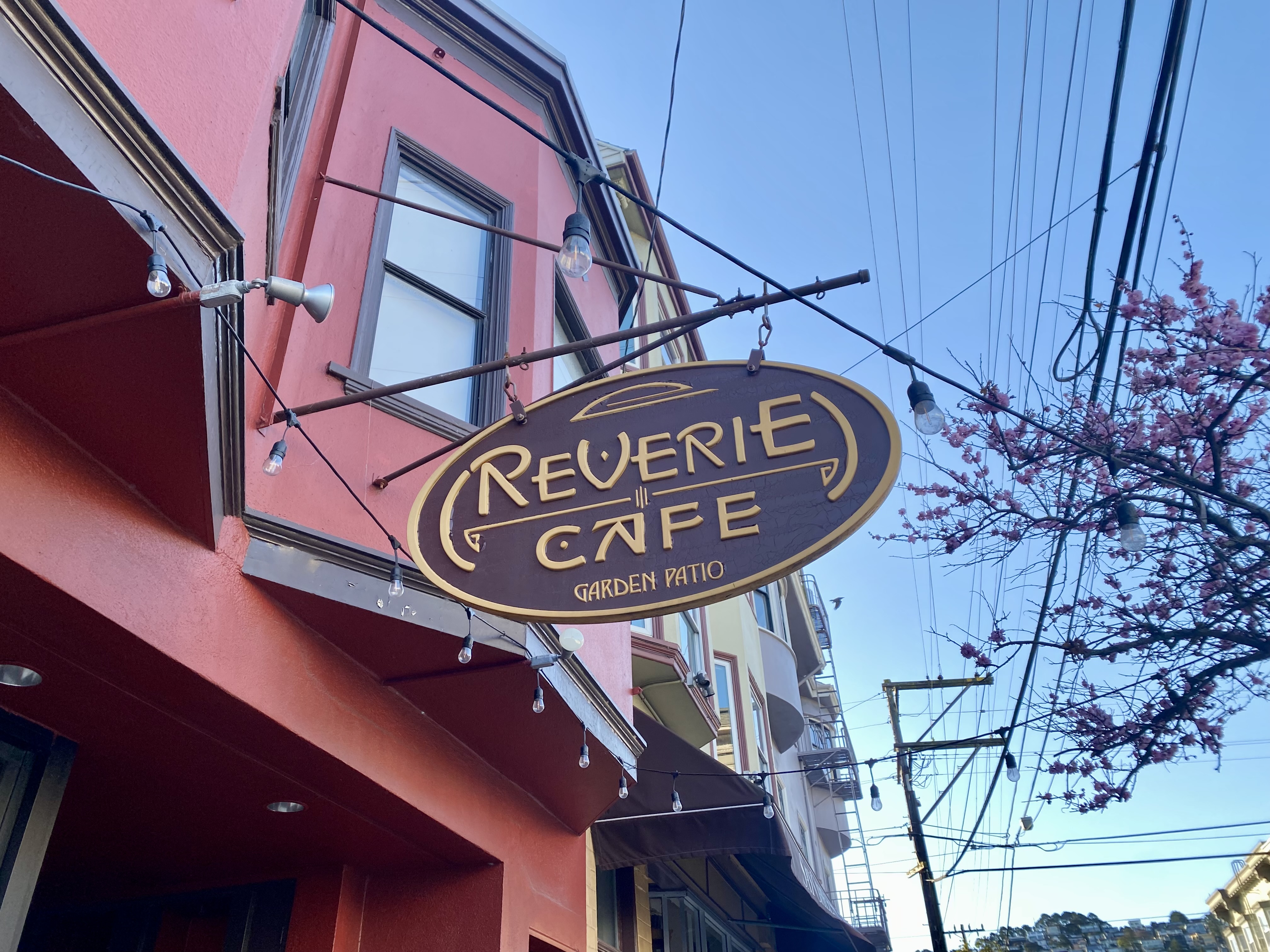 A sign outside Reverie Cafe.