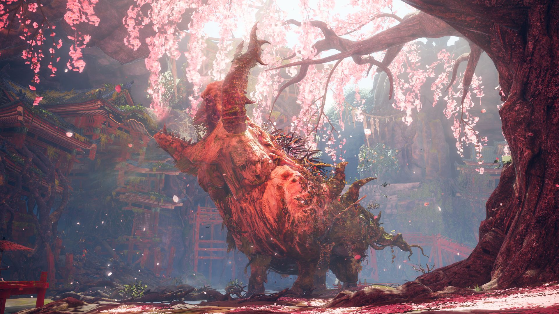 A giant beast roars in a mystical pink forest in Wild Hearts.