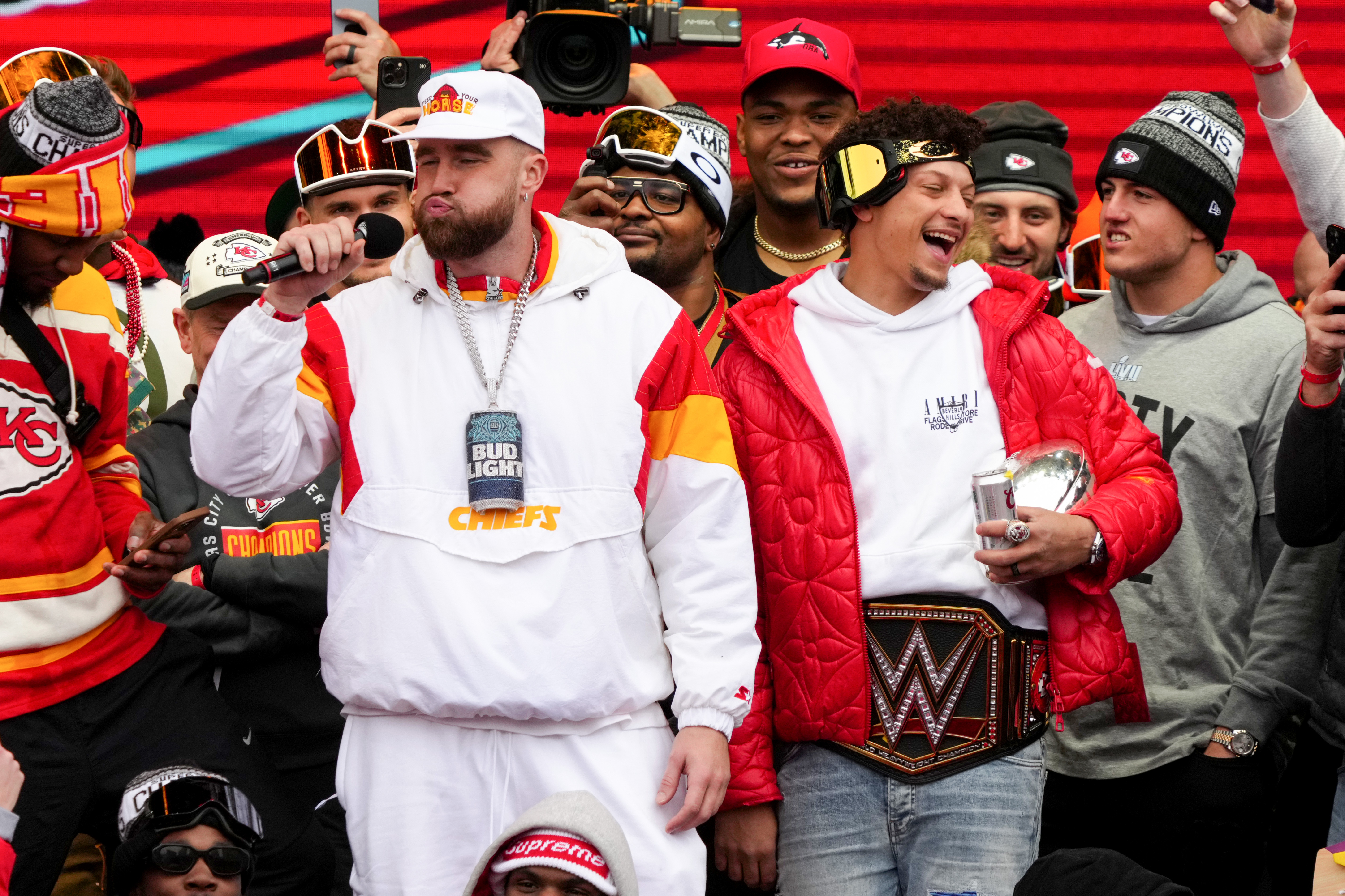 Travis Kelce #87 and Patrick Mahomes #15 of the Kansas City Chiefs celebrate on stage during the Kansas City Chiefs Super Bowl LVII victory parade on February 15, 2023 in Kansas City, Missouri.