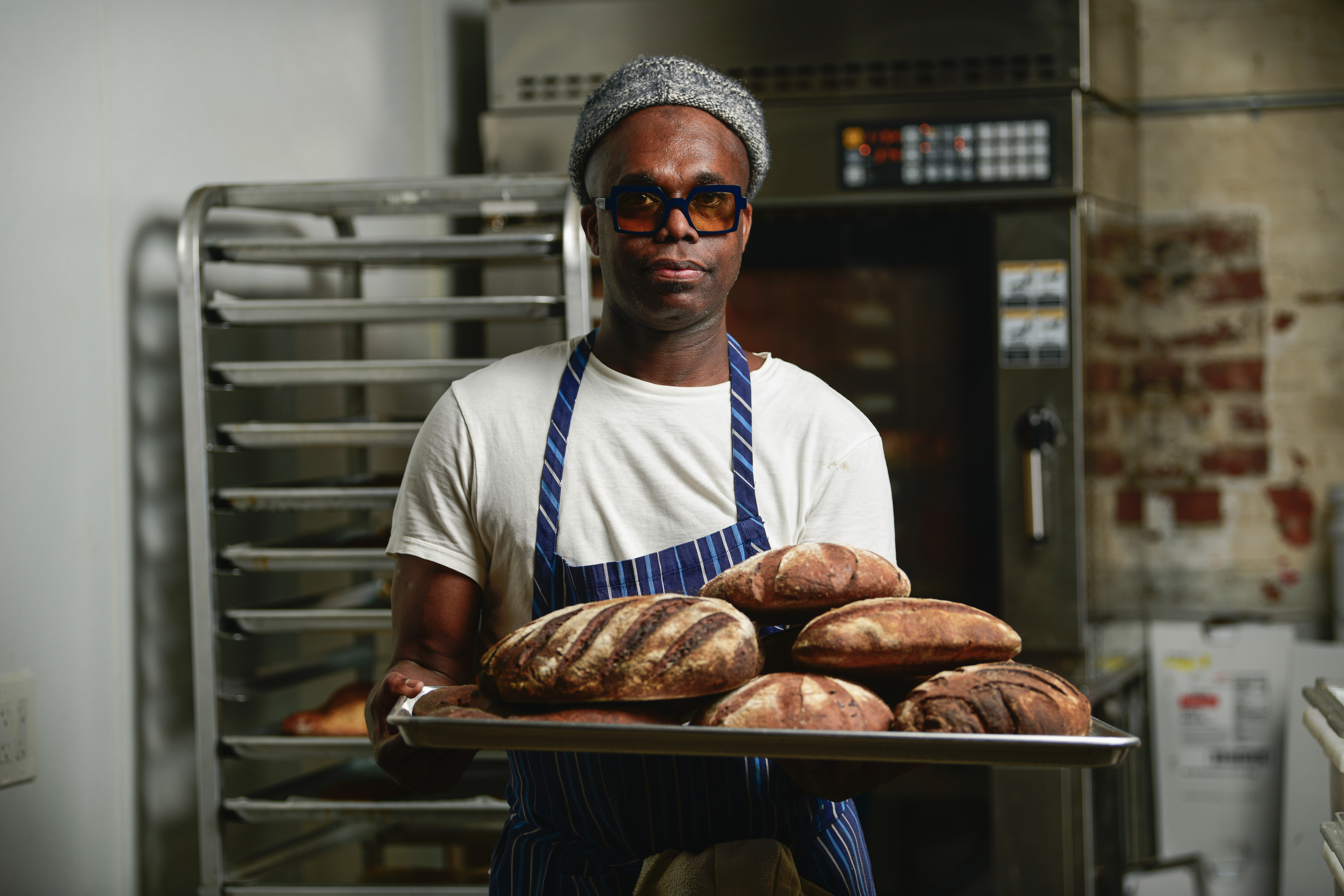 Amadou Ly holding bread.