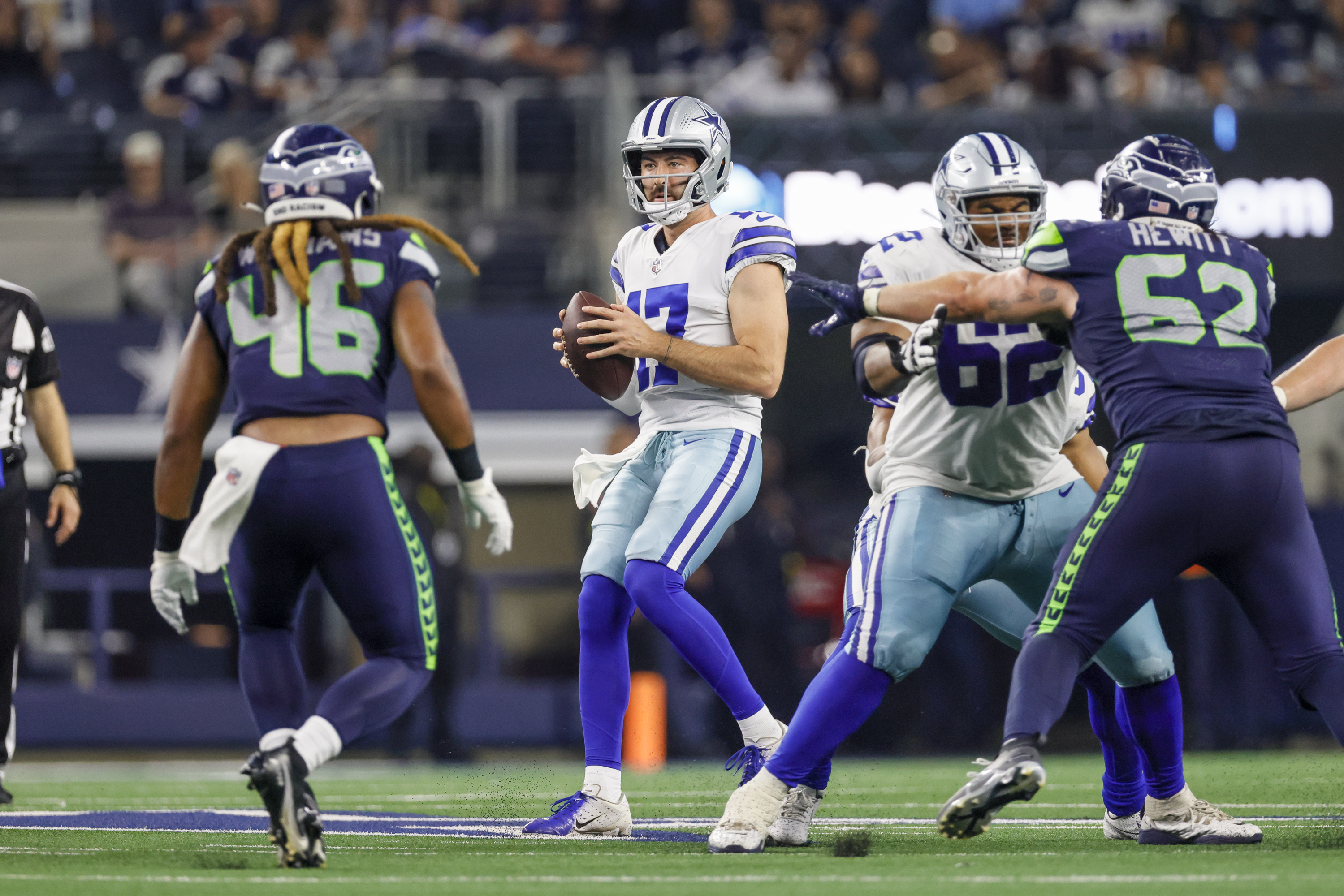 Dallas Cowboys quarterback Ben DiNucci looks for an open receiver downfield during the game between the Dallas Cowboys and the Seattle Seahawks on August 26, 2022 at AT&amp;T Stadium in Arlington, Texas.