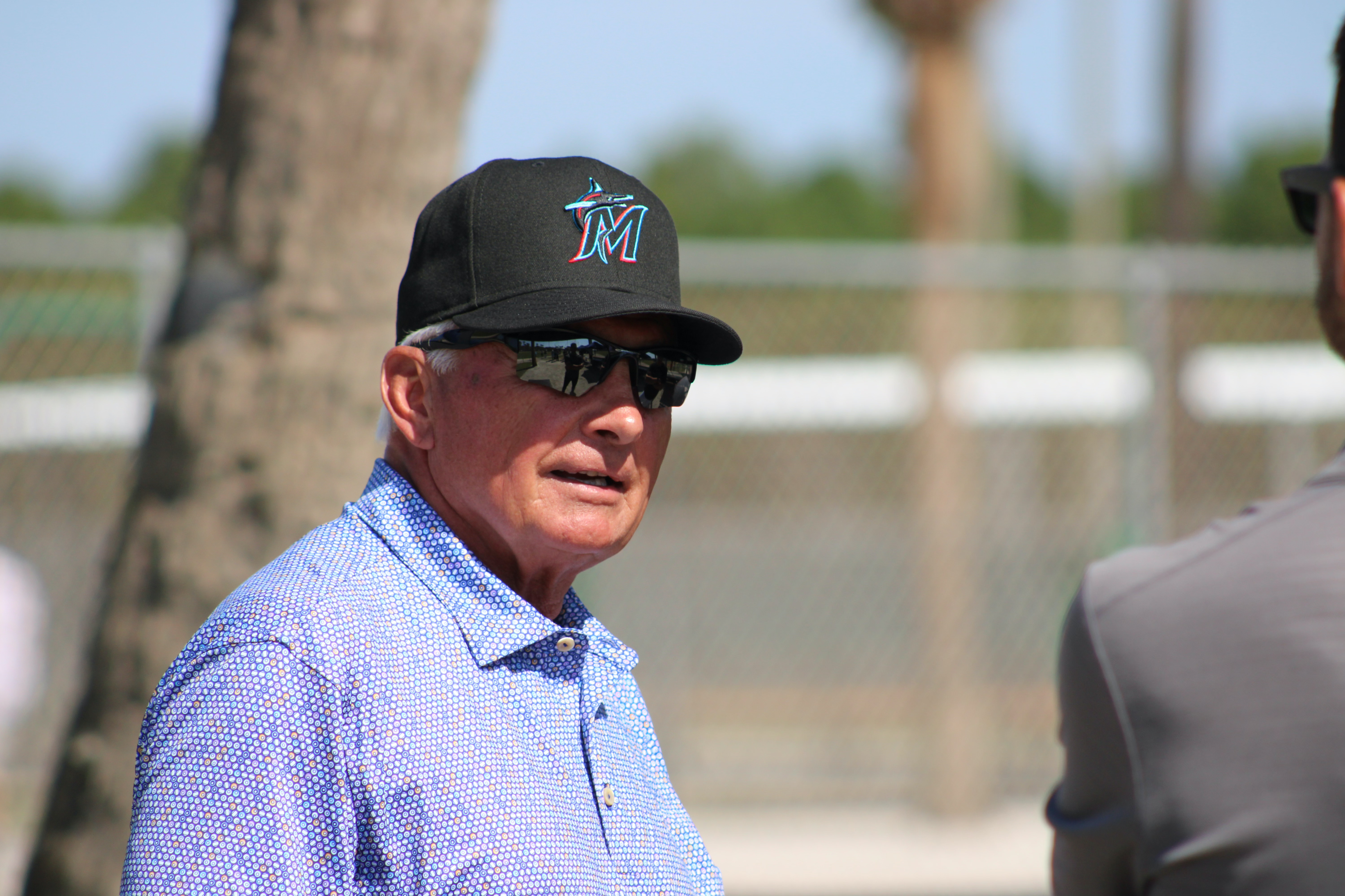 Newly hired baseball advisor Terry Collins wears a Marlins hat and sunglasses while attending 2023 Spring Training at Roger Dean Chevrolet Stadium in Jupiter, FL
