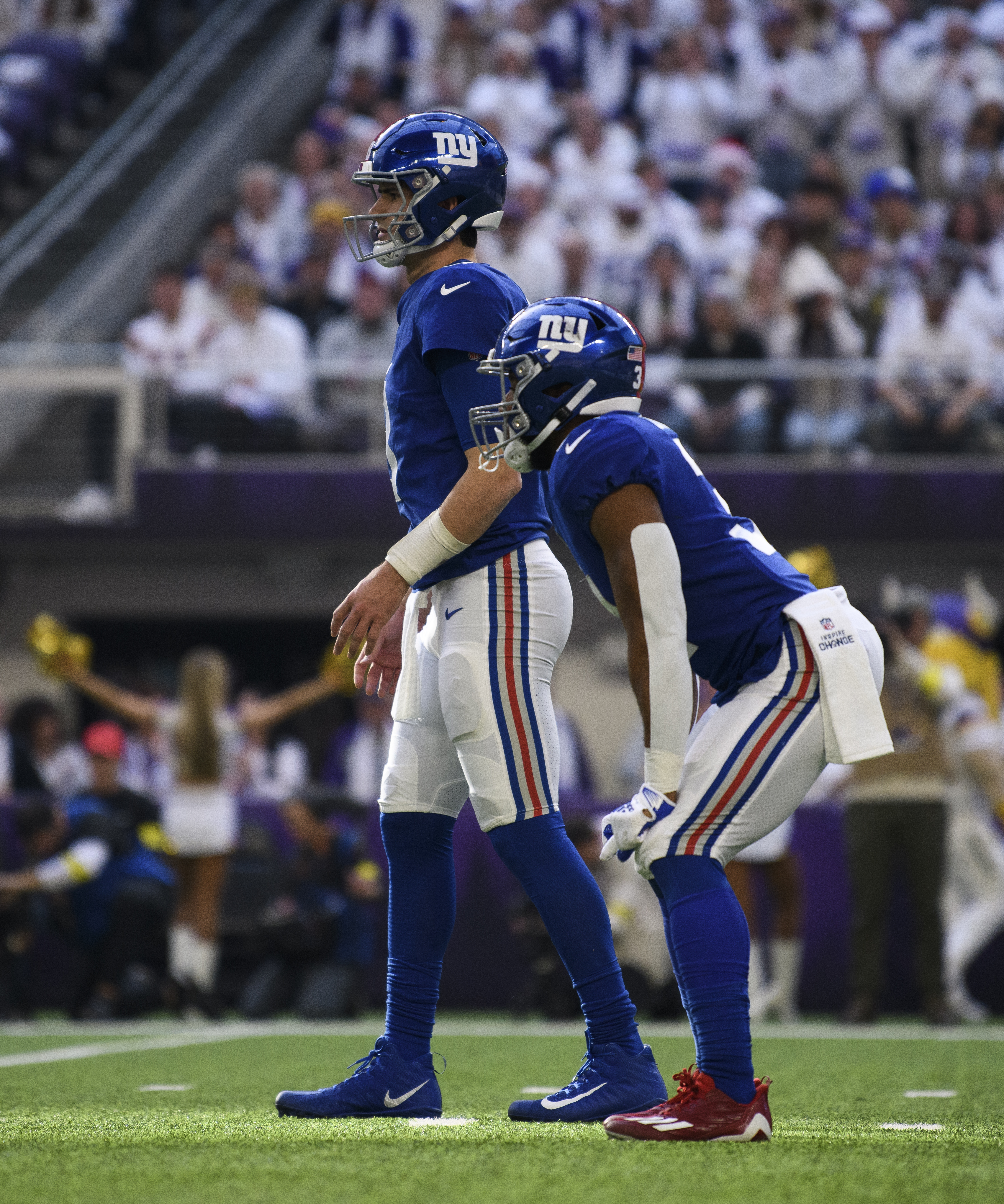 Daniel Jones #8 of the New York Giants lines up for a play in the first quarter of the game against the Minnesota Vikings at U.S. Bank Stadium on December 24, 2022 in Minneapolis, Minnesota.