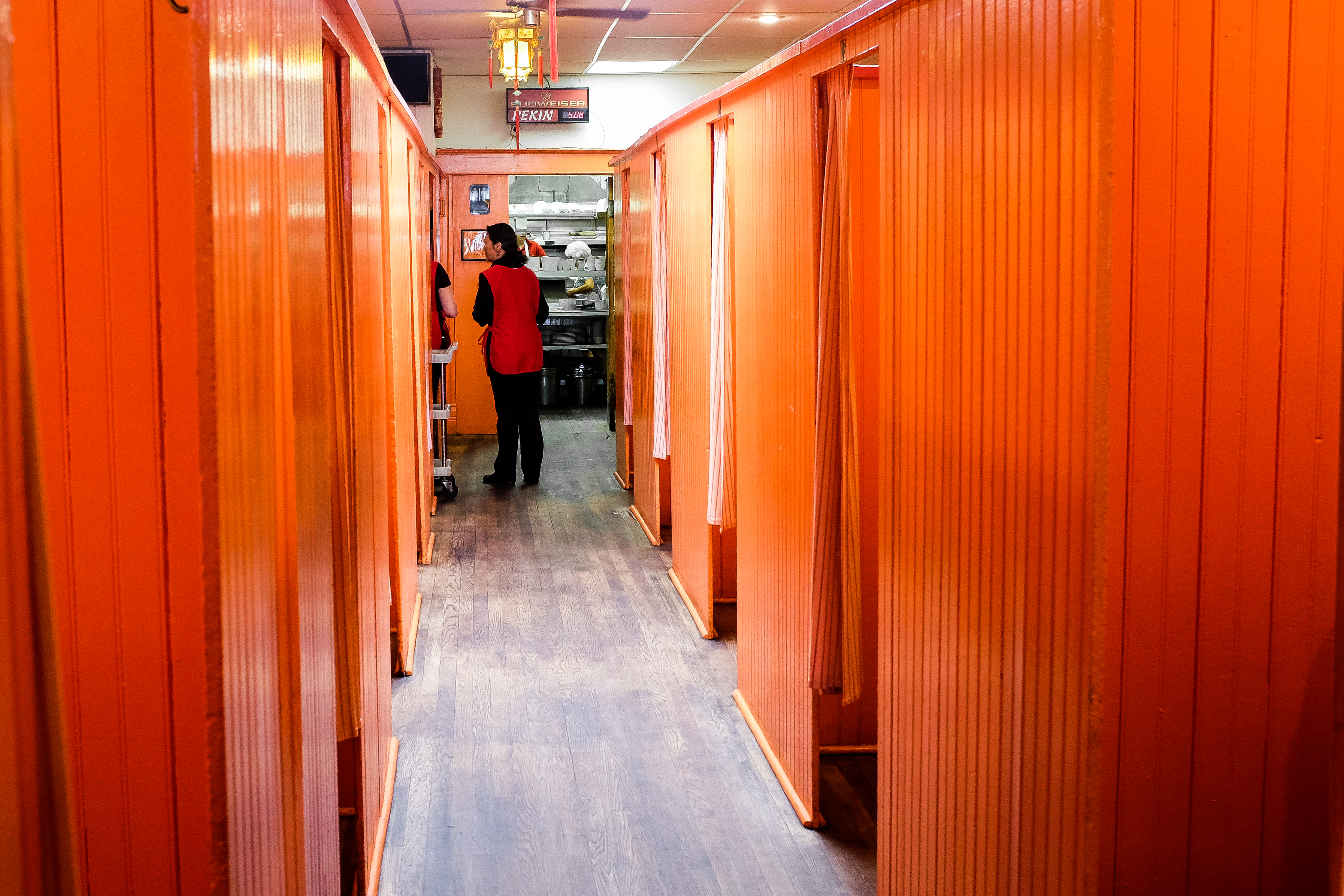 A narrow hallway inside Pekin Noodle Parlor.