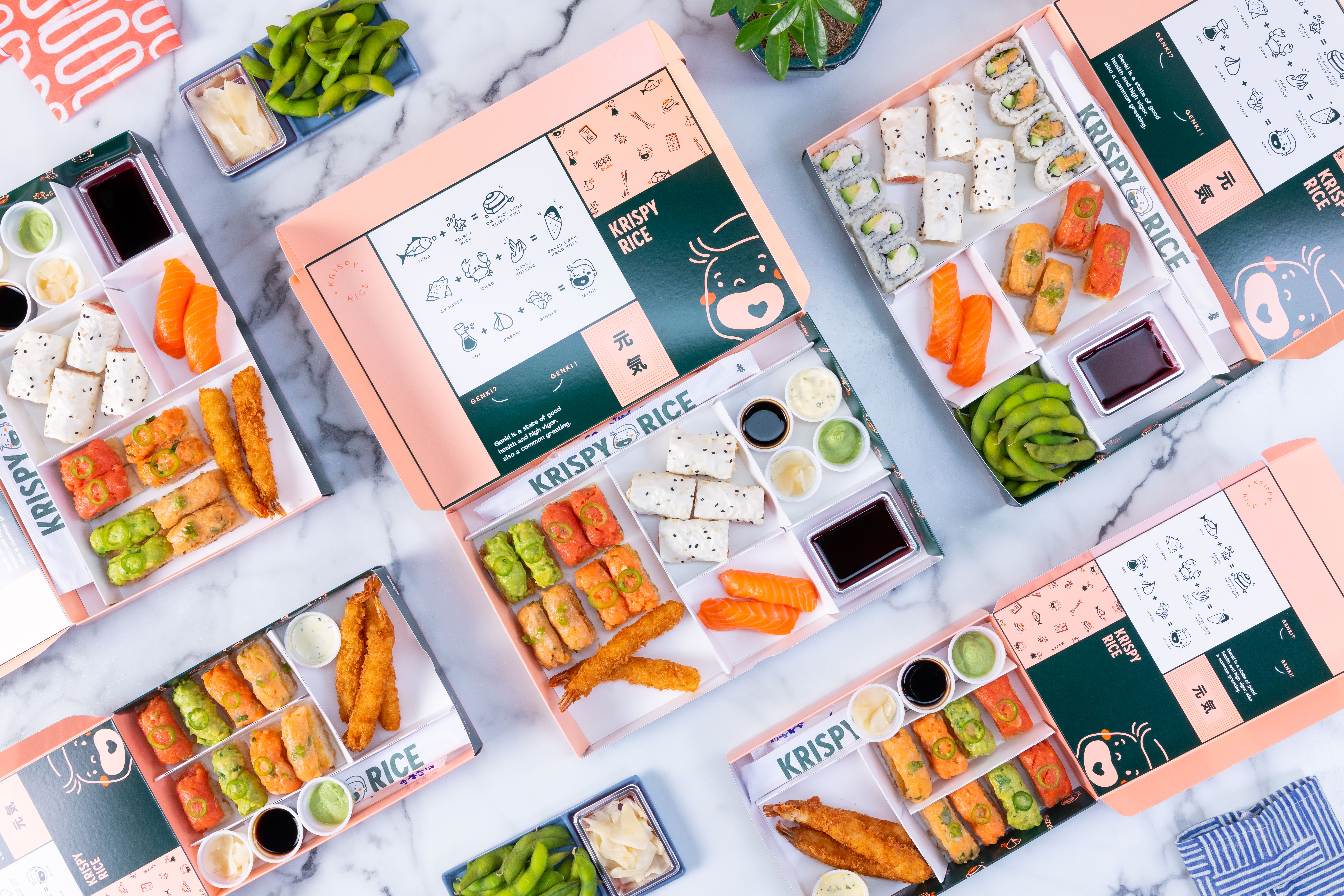 A selection of pink and turquoise sushi bento boxes from Krispy Rice, one of 13 restaurant stalls opening at the Citizens Market food hall at Phipps Plaza in Atlanta. 