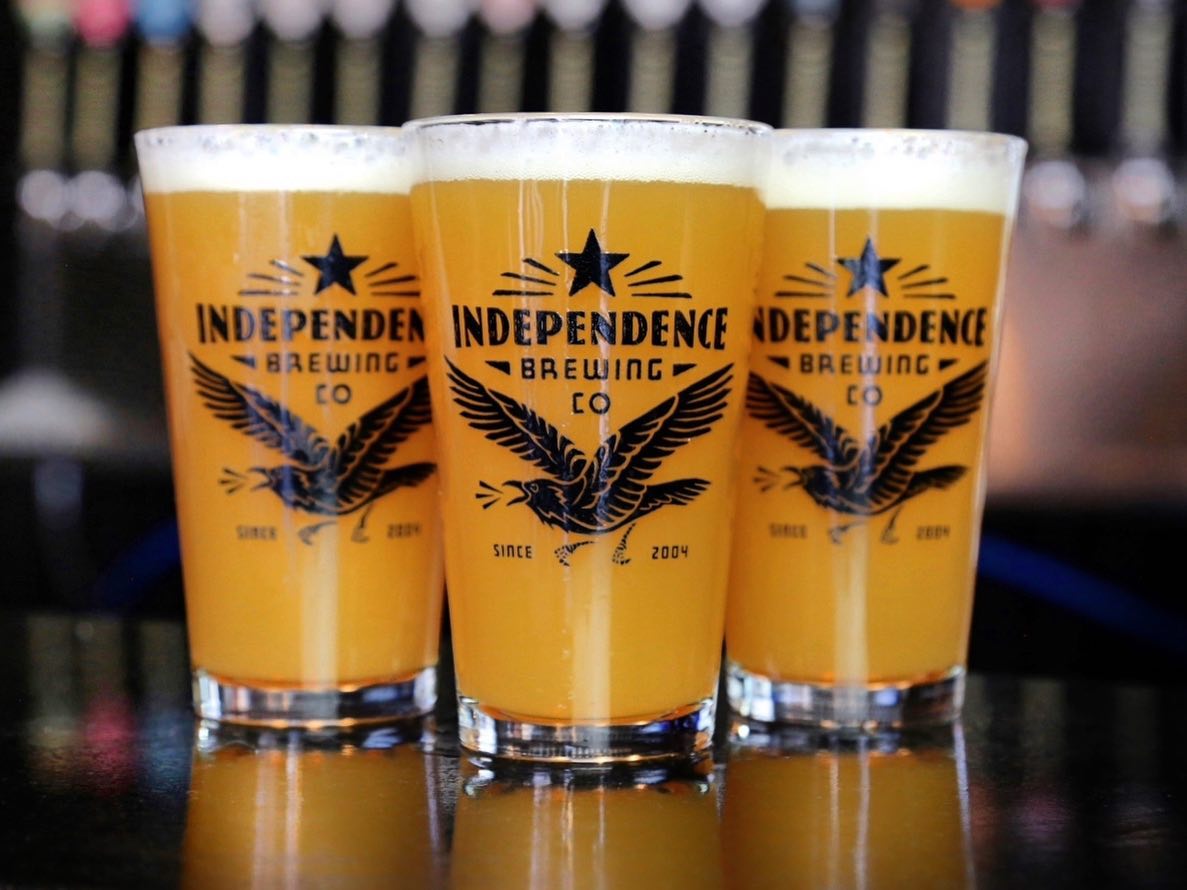 Three beers in glasses that read “Independence Brewing Co.”