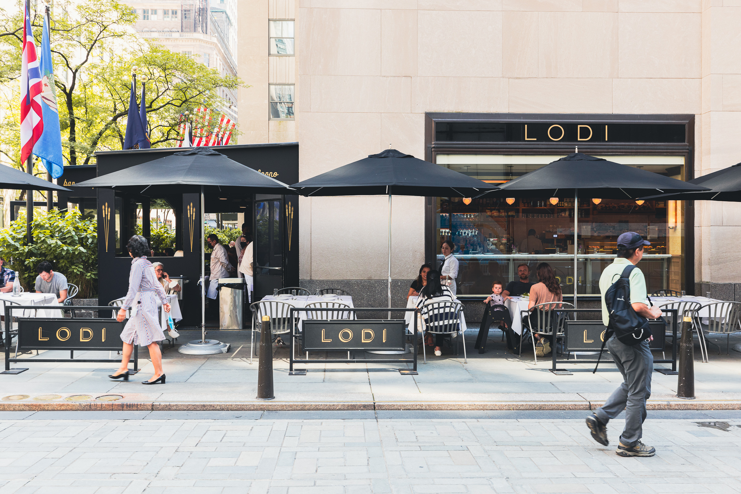 Tourists pass in front of Lodi, one of several restaurants that have opened at Rockefeller Center in Manhattan.
