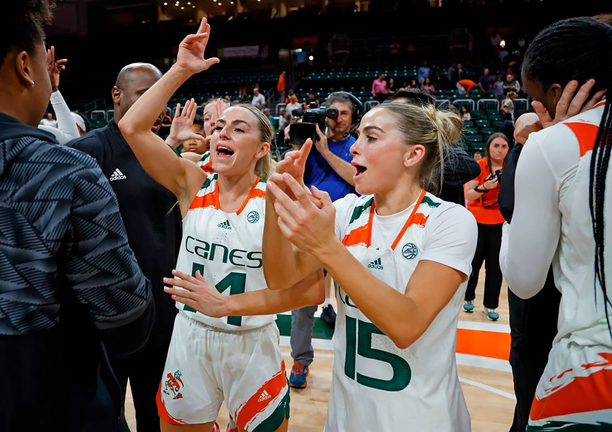 Miami’s Haley Cavinder and Hanna Cavinder celebrate after an 86-82 win against Florida State at the Watsco Center on Feb. 9, 2023, in Coral Gables, Florida.
