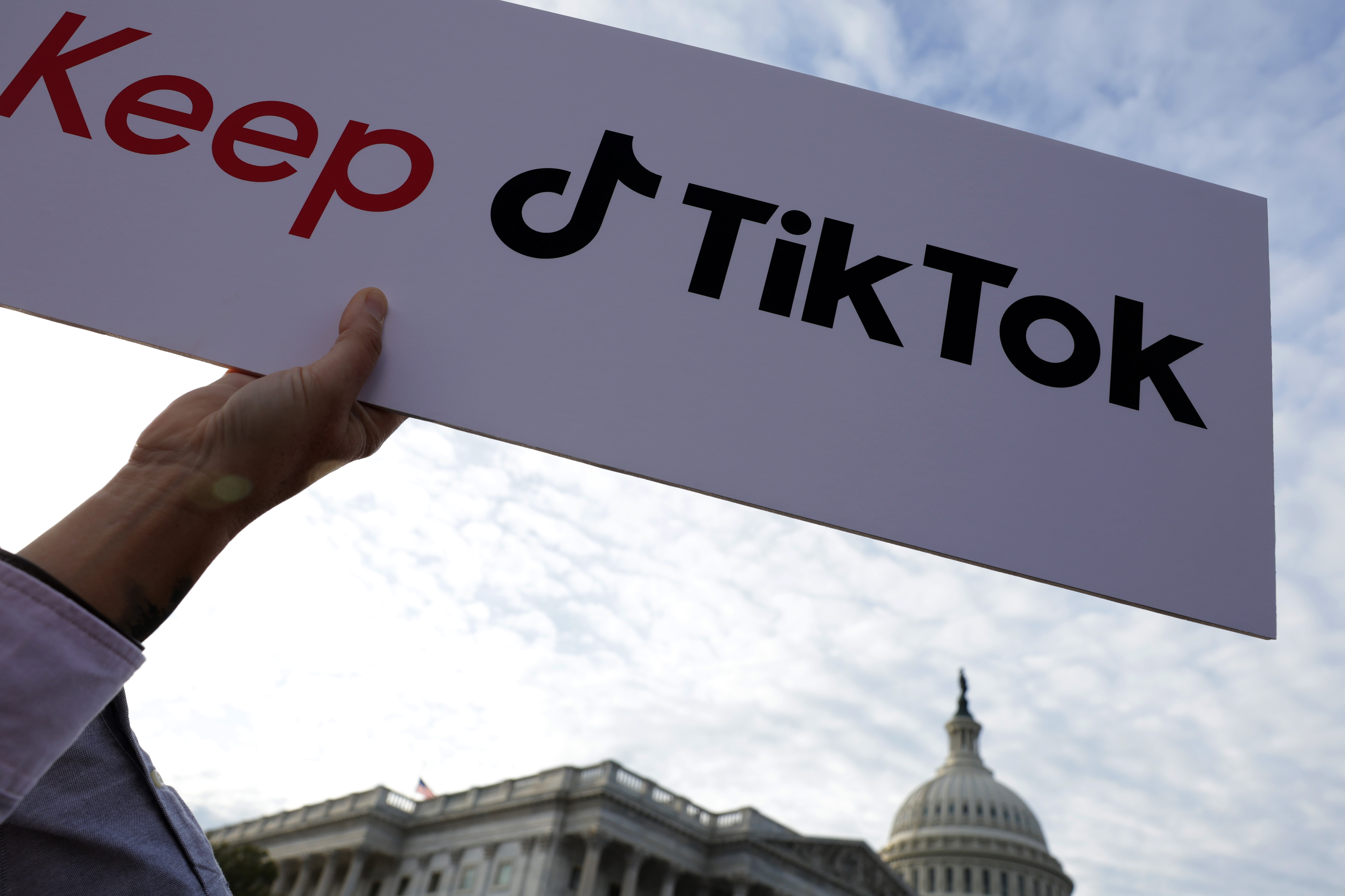 A supporter holds up a sign that read “Keep TikTok” during a news conference on TikTok in front of the U.S. Capitol on March 22, 2023.