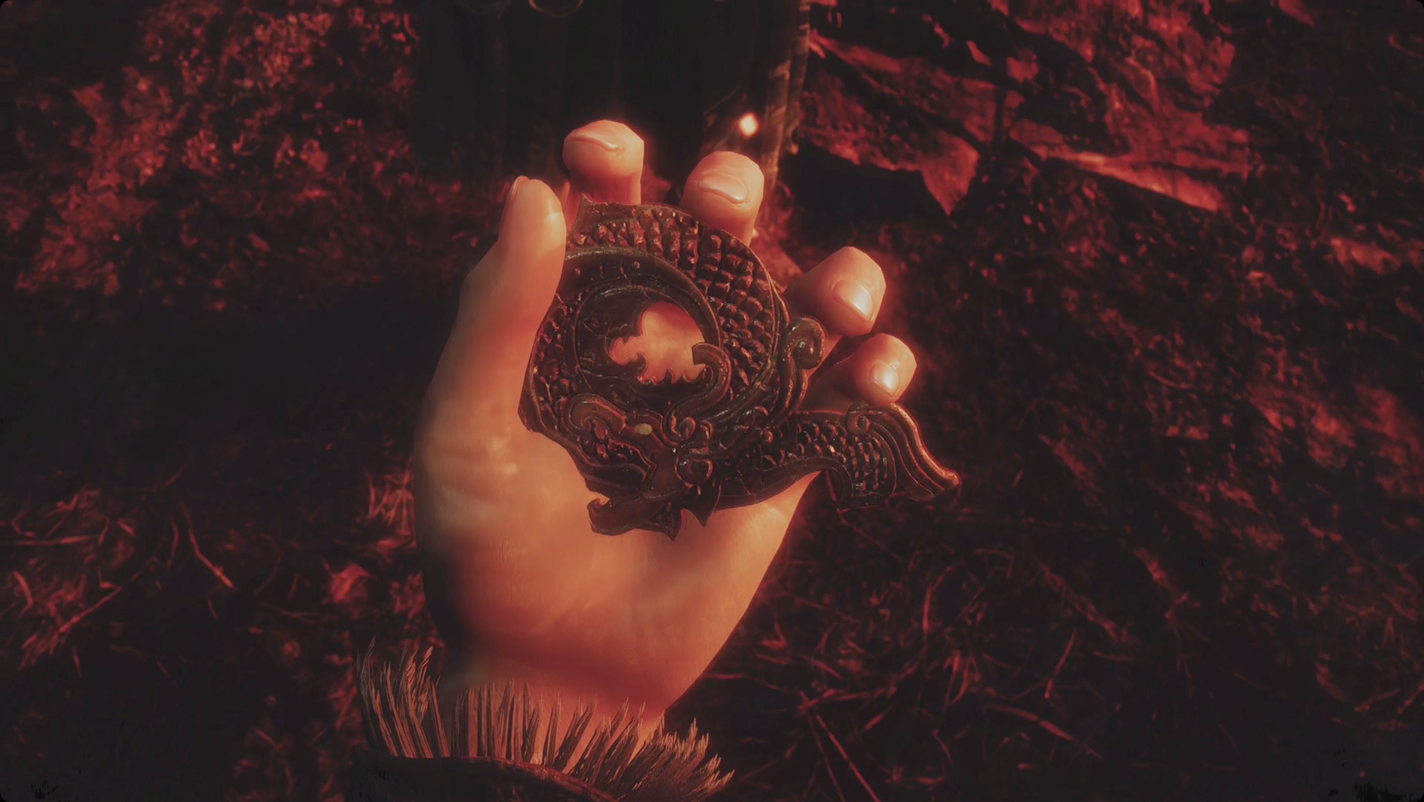 Wo Long screenshot of a hand holding a jade ornament