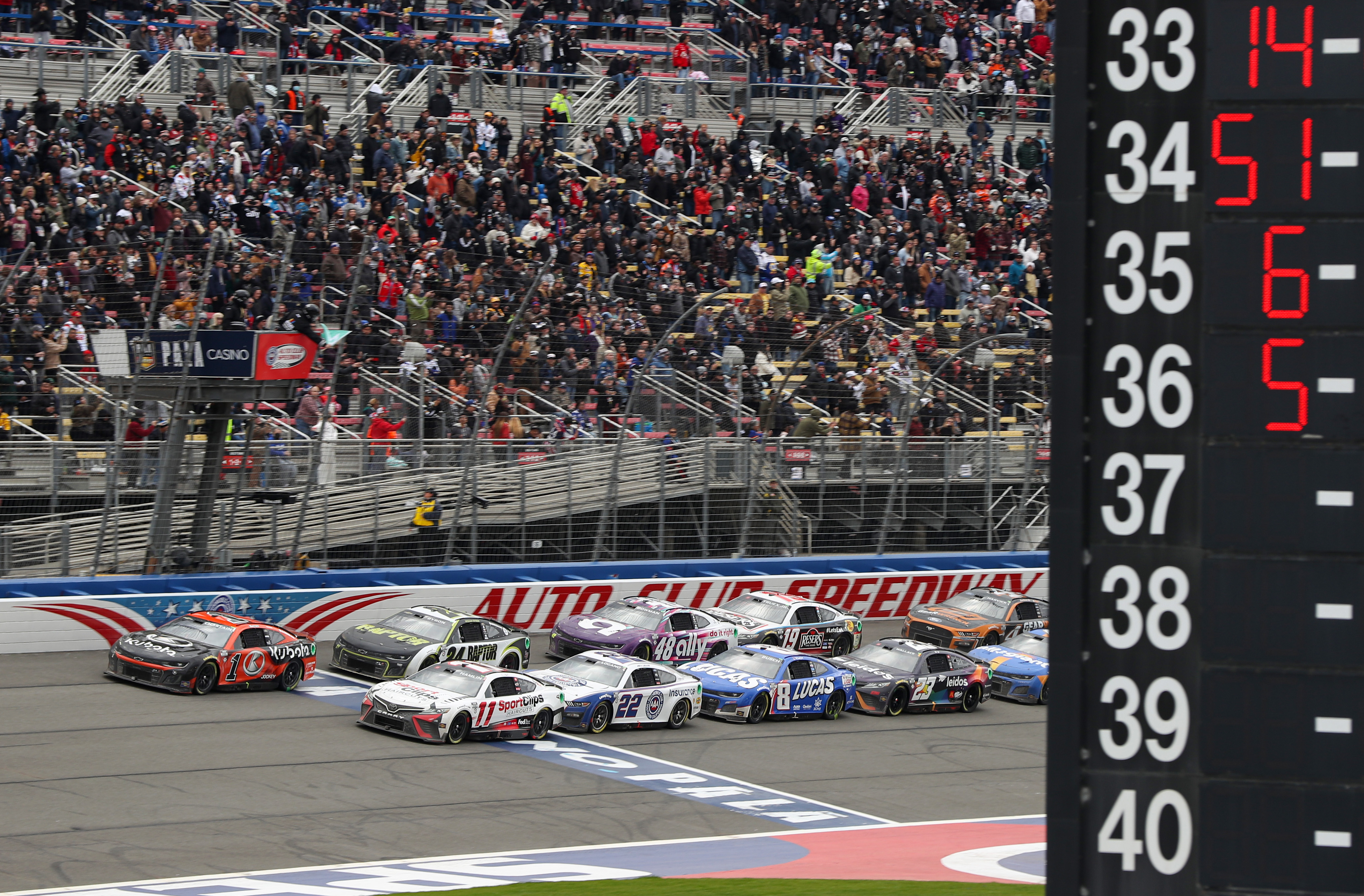 Ross Chastain, driver of the #1 Kubota Chevrolet, leads the field to start stage two after winning stage one during the NASCAR Cup Series Pala Casino 400 at Auto Club Speedway on February 26, 2023 in Fontana, California.