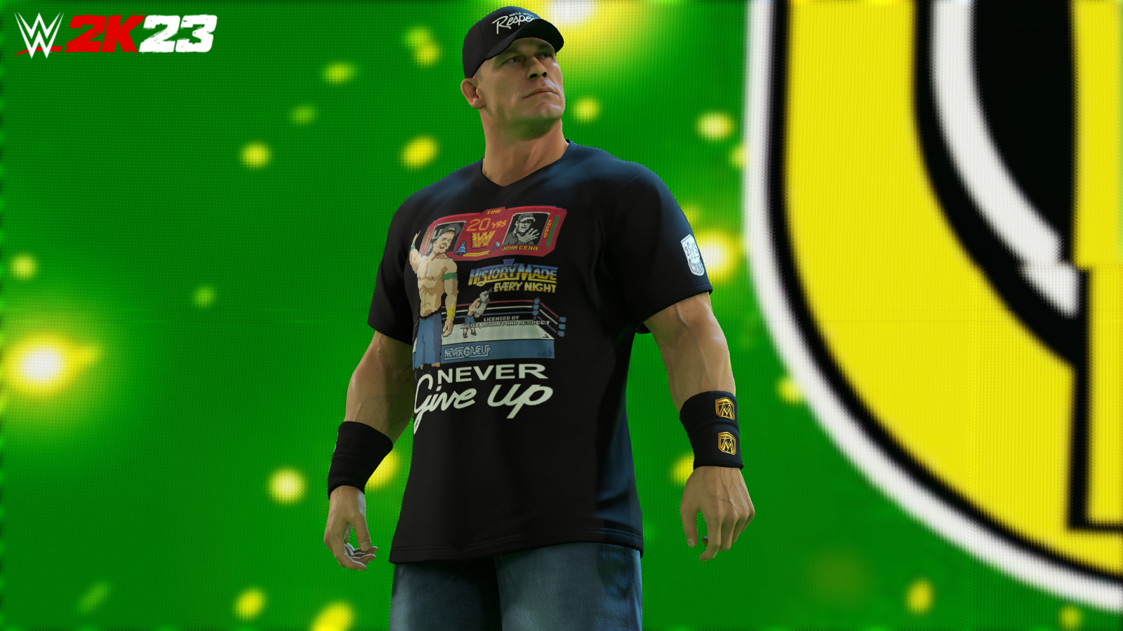 WWE superstar John Cena making his entrance in WWE 2K23; he is wearing a t-shirt that shows him wrestling in 8-bit video game art, over the motto “Never Give Up.”