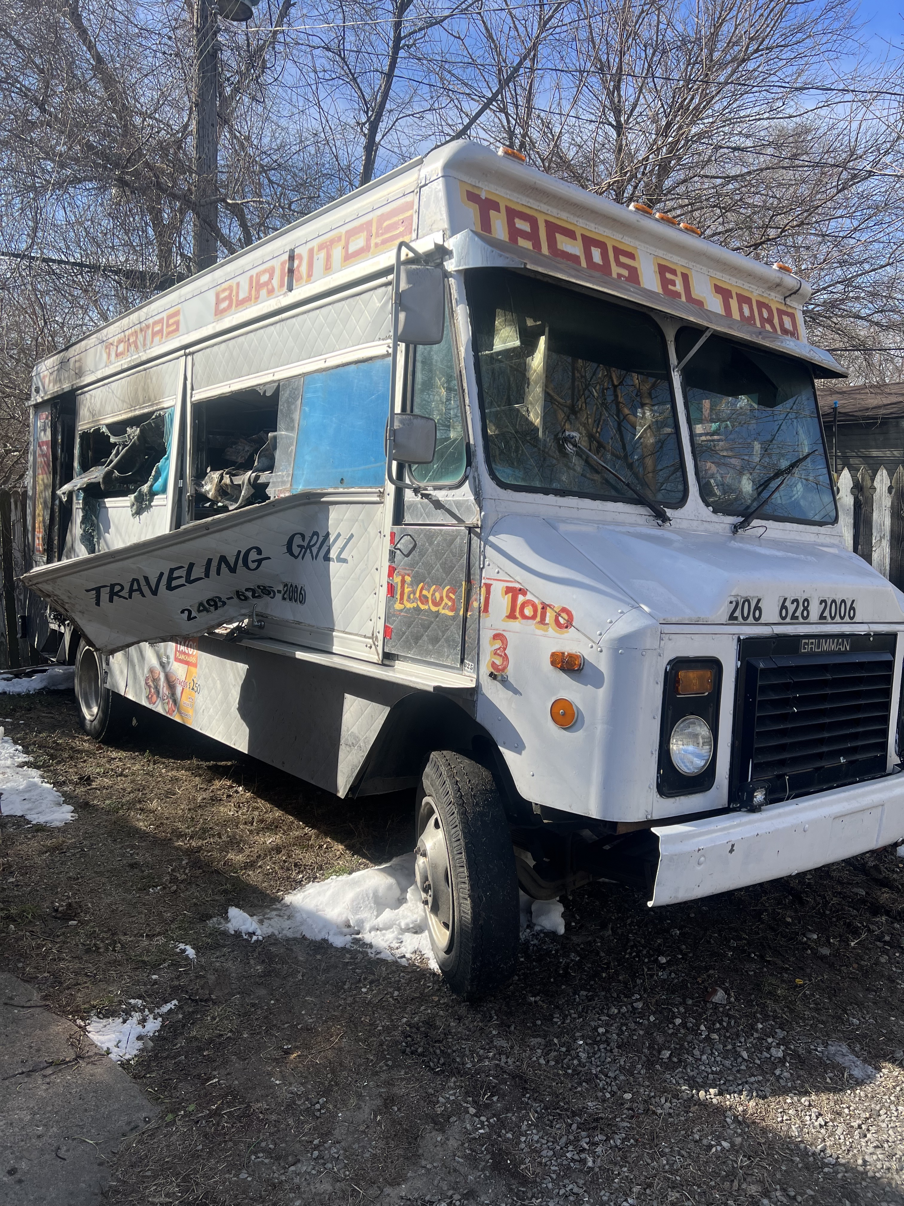 A white taco truck damaged by fire in Detroit, Michigan.