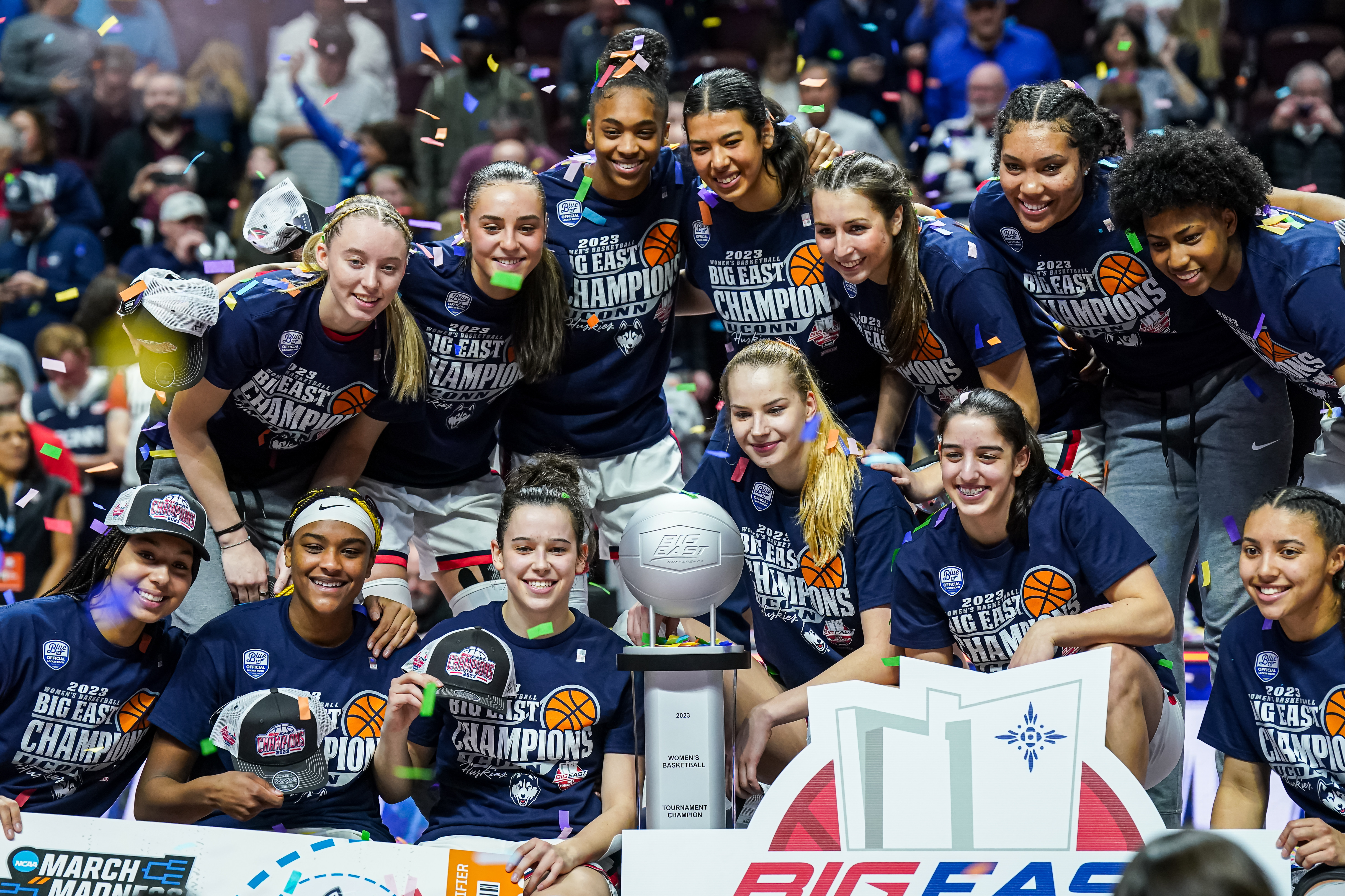 The UConn Huskies pose for a photo after defeating the Villanova Wildcats in the Big East Conference Tournament Championship at Mohegan Sun Arena.