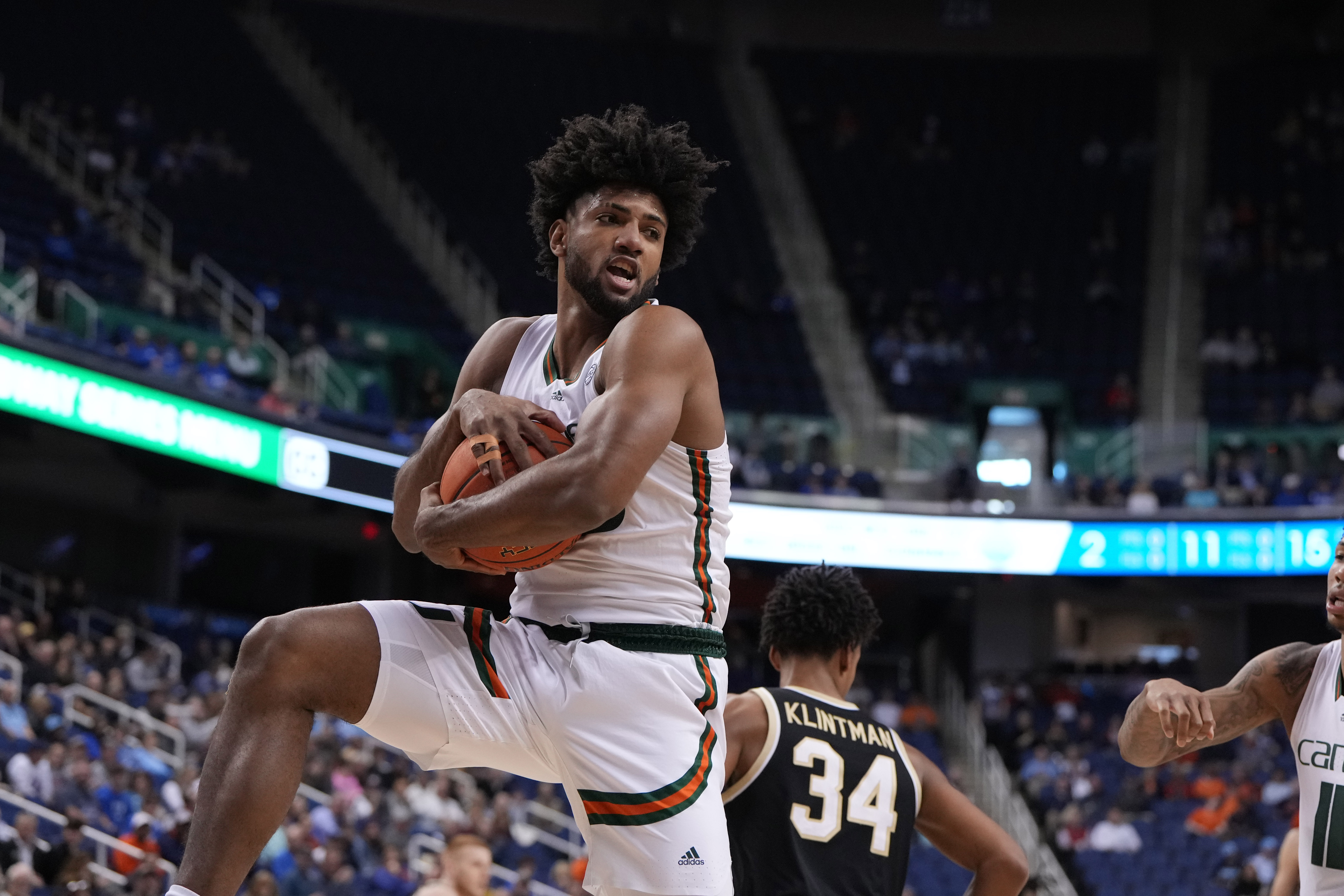 Miami Hurricanes forward Norchad Omier grabs a rebound during the first half of the quarterfinals of the ACC tournament at Greensboro Coliseum.
