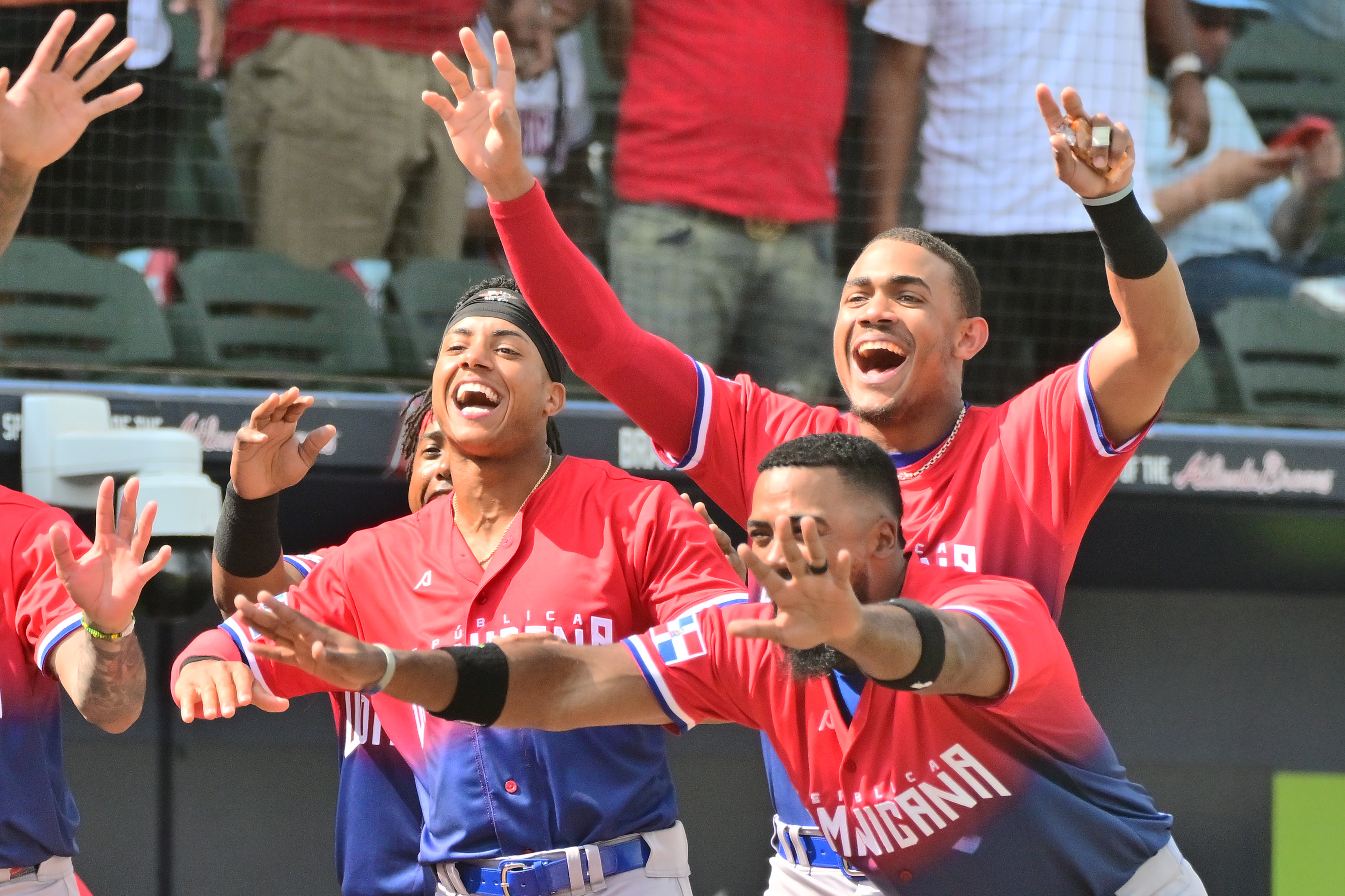 Jeremy Peña #3, Julio Rodriguez #44, and Teoscar Hernandez #37 react after Jeremy Celedonio #29 of the Dominican Republic hit a two-run home run in the sixth inning against the Atlanta Braves during an exhibition game at CoolToday Park on March 08, 2023 in North Port, Florida.