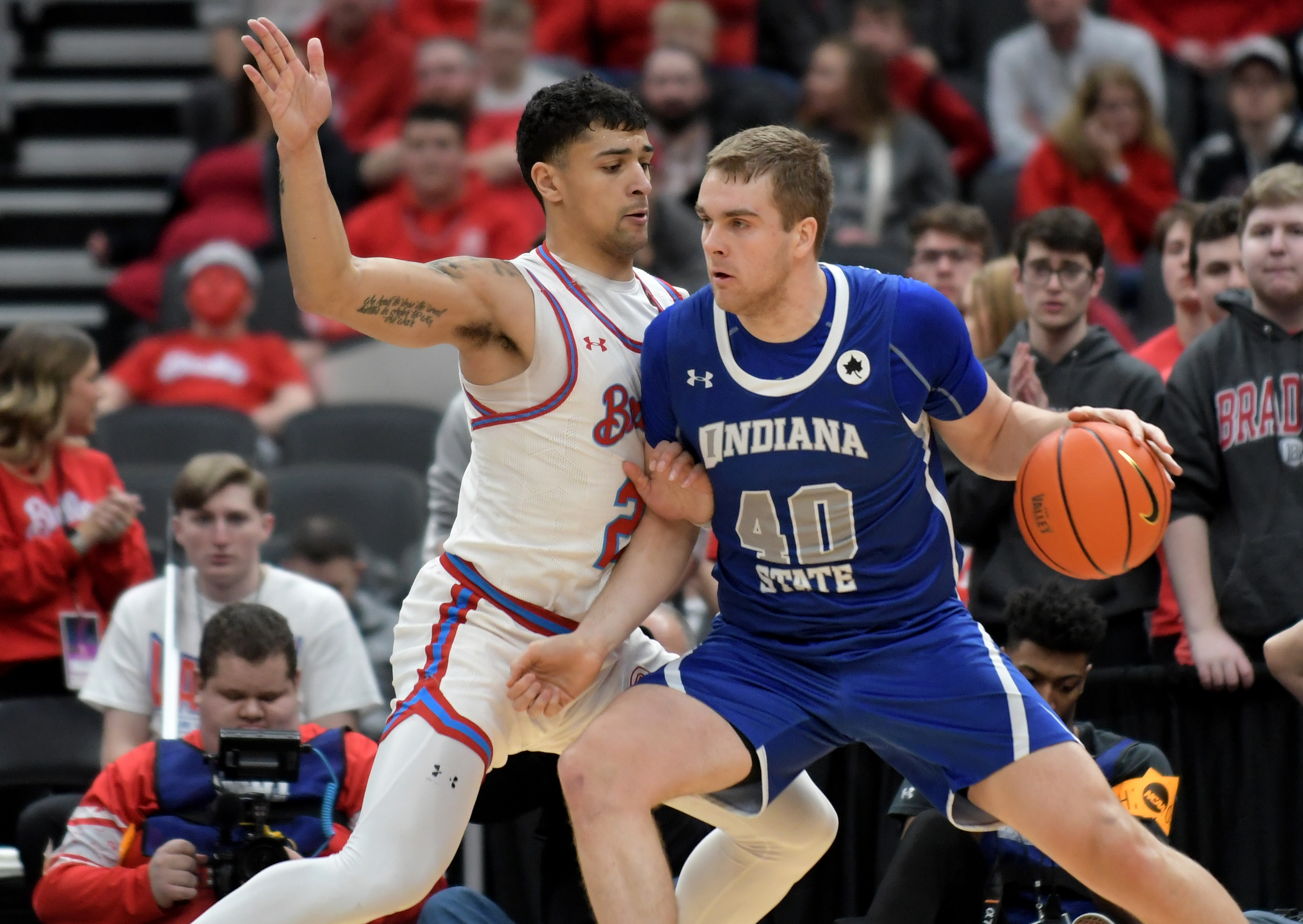 Indiana State Sycamores forward Cade McKnight drives the ball against Bradley Braves forward Ja’Shon Henry during the first half at Enterprise Center.