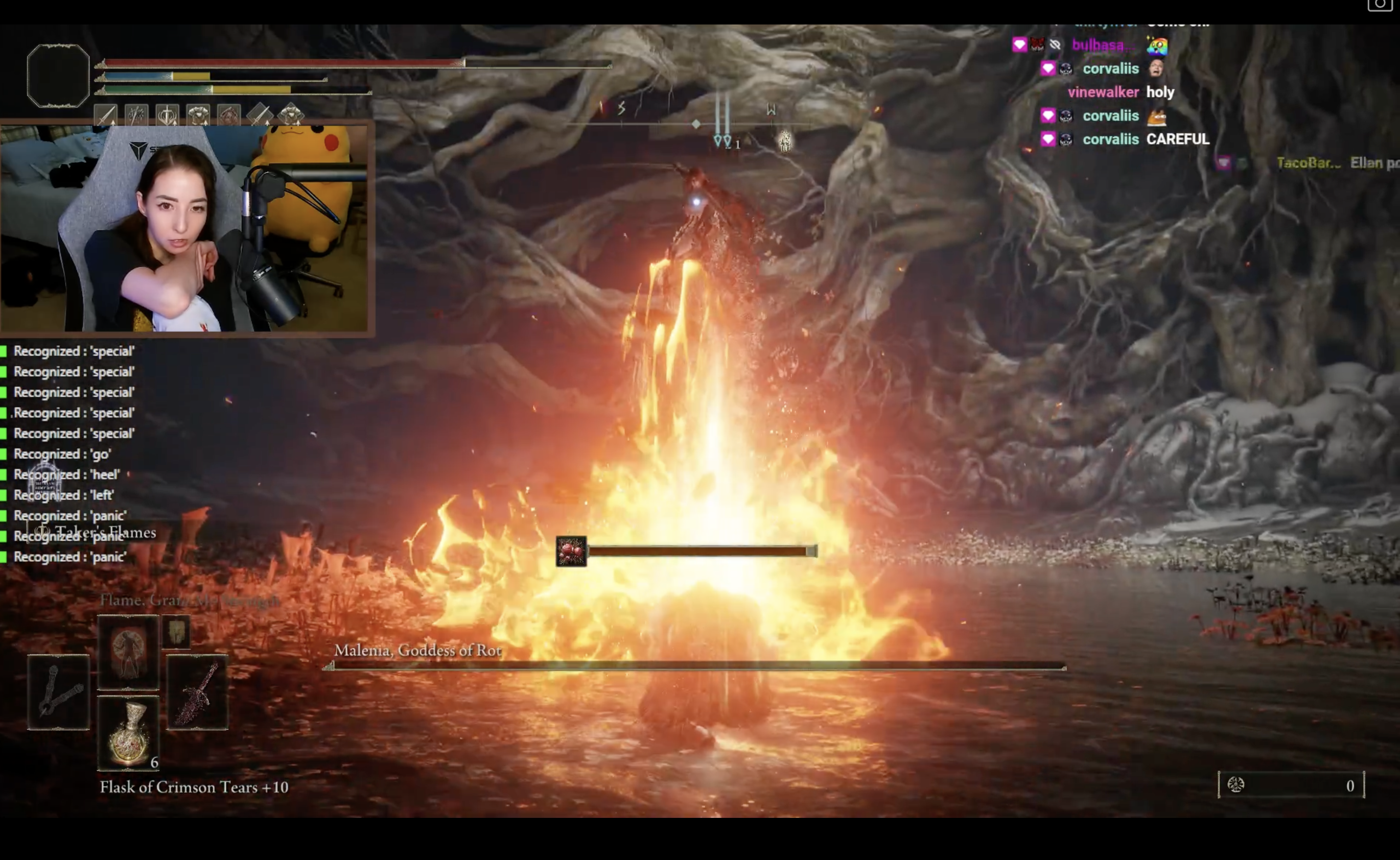 Elden Ring’s Malenia going up in flame after the player character launches an attack at her. A Twitch streamer’s image, speaking into a microphone, is in the upper left.
