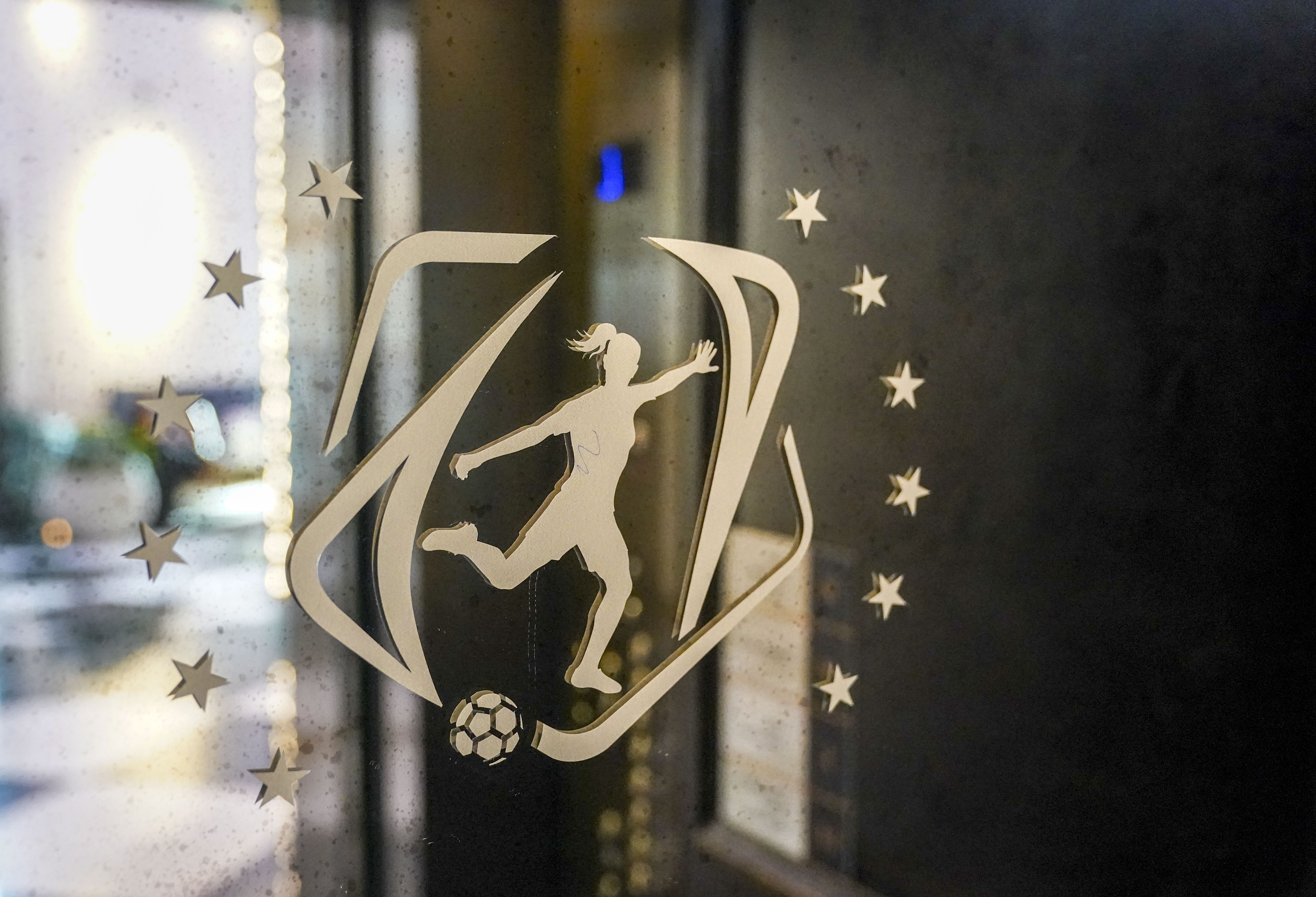 NWSL: Washington Hotel Views: NWSL logo, player with ponytail, gold plated