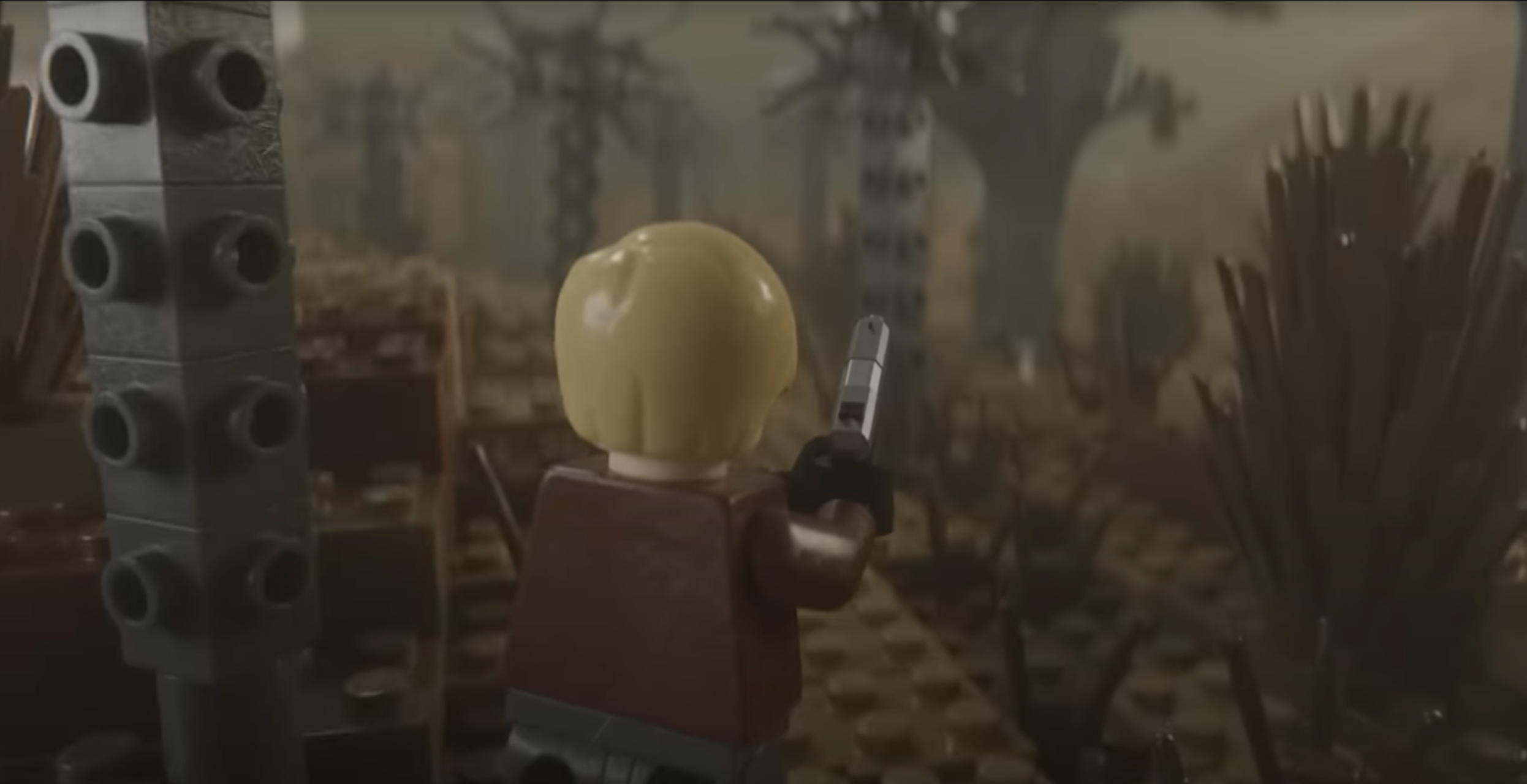 a screencap of a YouTuber’s Lego remake of Resident Evil 4, showing Lego Leon S. Kennedy walking through some Lego woods. 