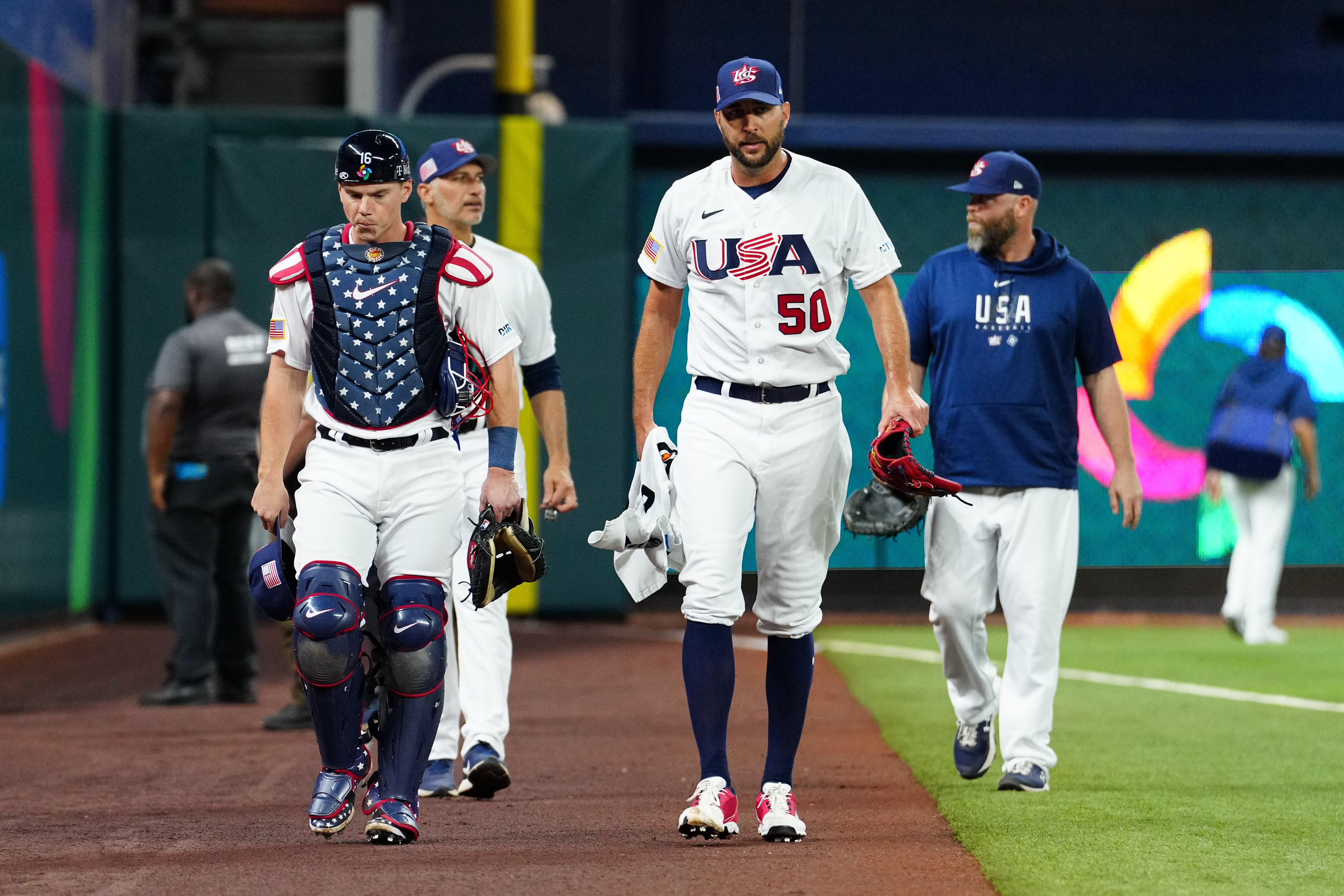 Will Smith #16 and Adam Wainwright #50 of Team USA take the field prior to the 2023 World Baseball Classic Semifinal game between Team Cuba and Team USA at loanDepot Park on Sunday, March 19, 2023 in Miami, Florida.