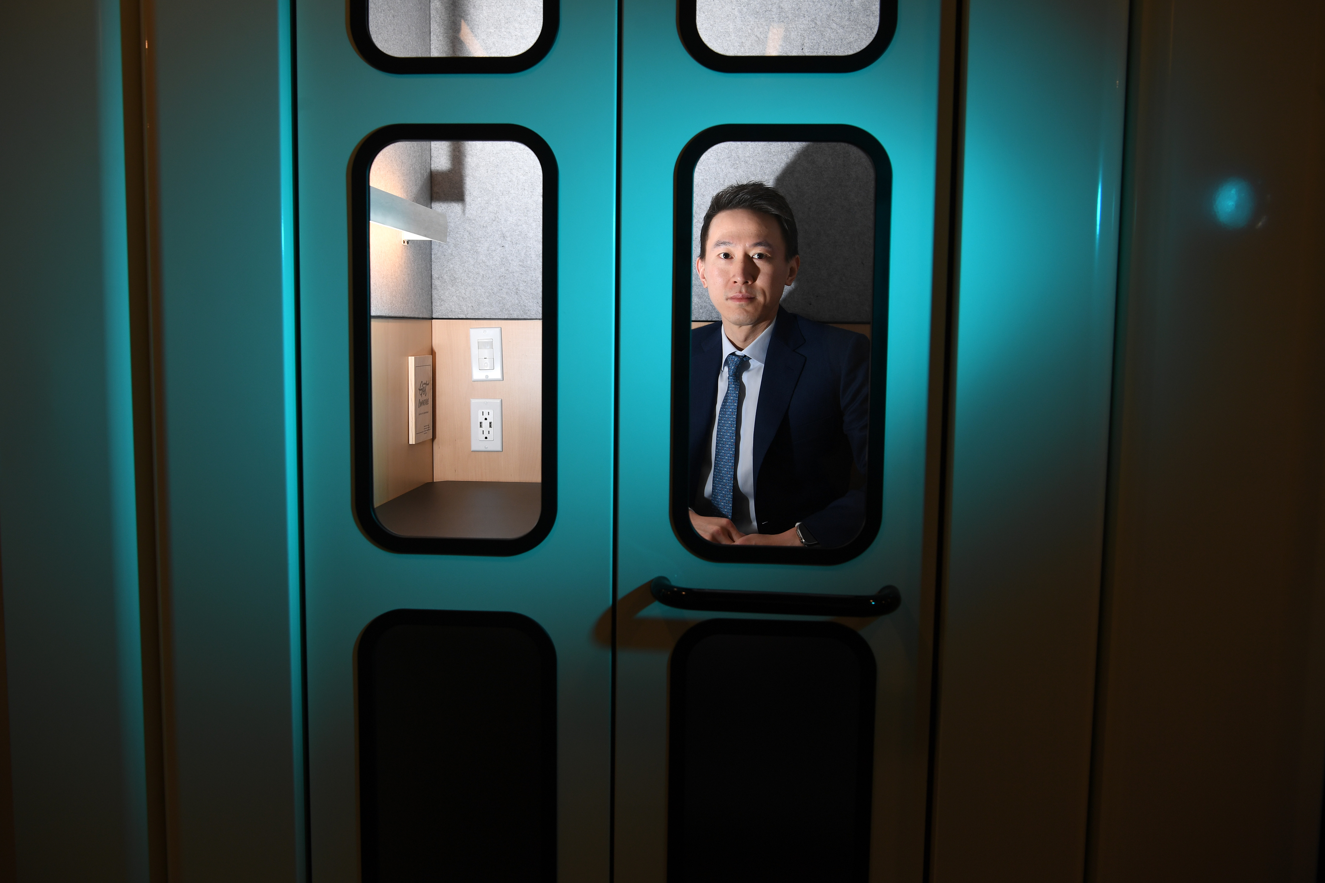 TikTok CEO Shou Zi Chew in a phone booth.