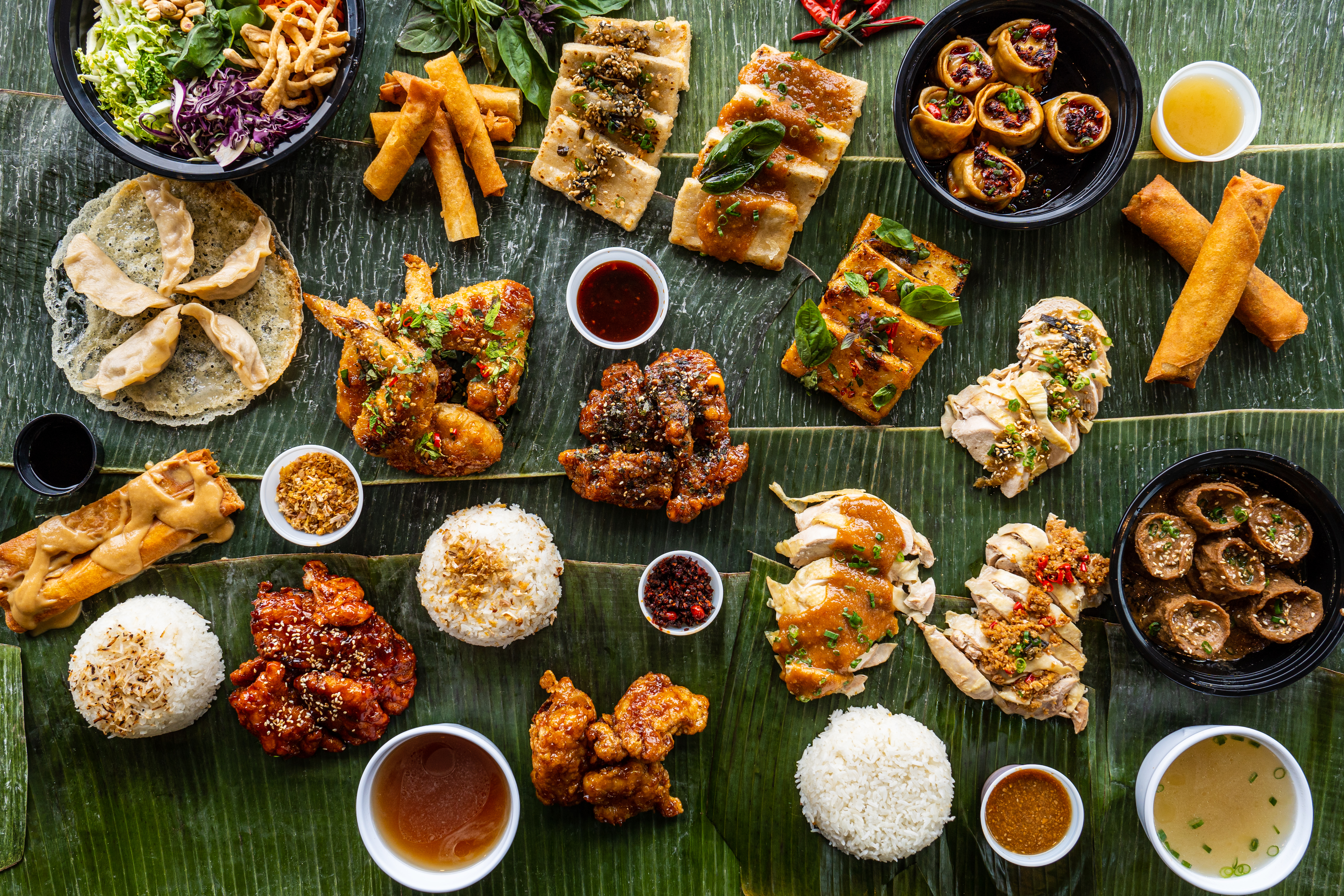 An assortment of food on banana leaves.