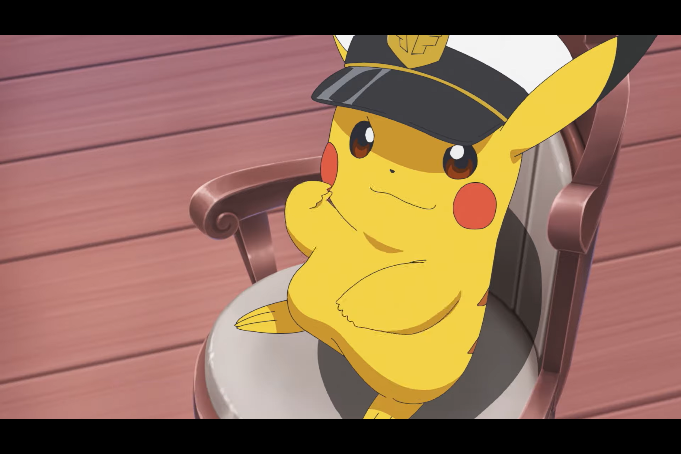 Pikachu wearing a captain’s hat, sitting in hair