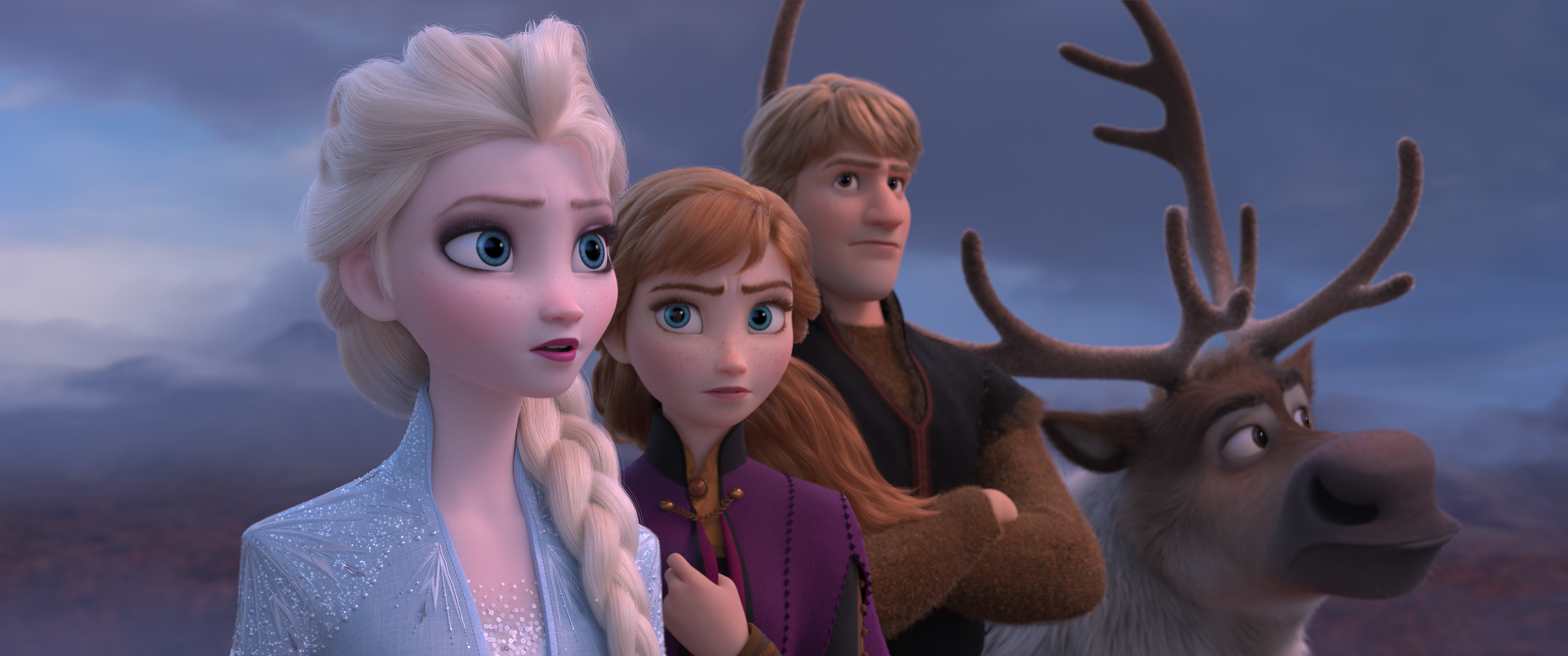 Princesses Elsa and Anna and their buddies Kristoff and Sven the reindeer stand together in Frozen II, looking off toward the horizon