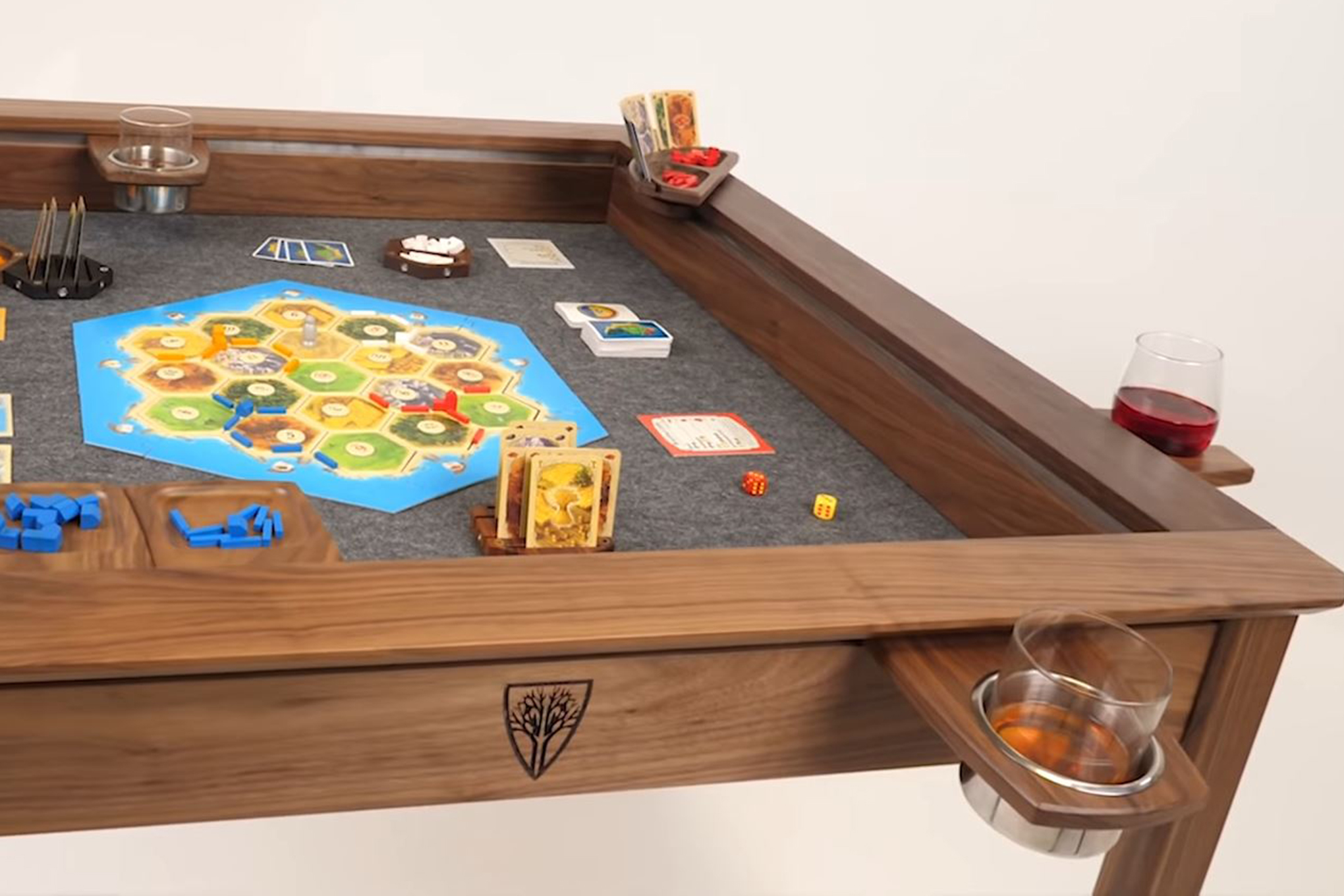 A Wyrmwood Modular Gaming Table, showing multiple accessories including cup holders and card holders.