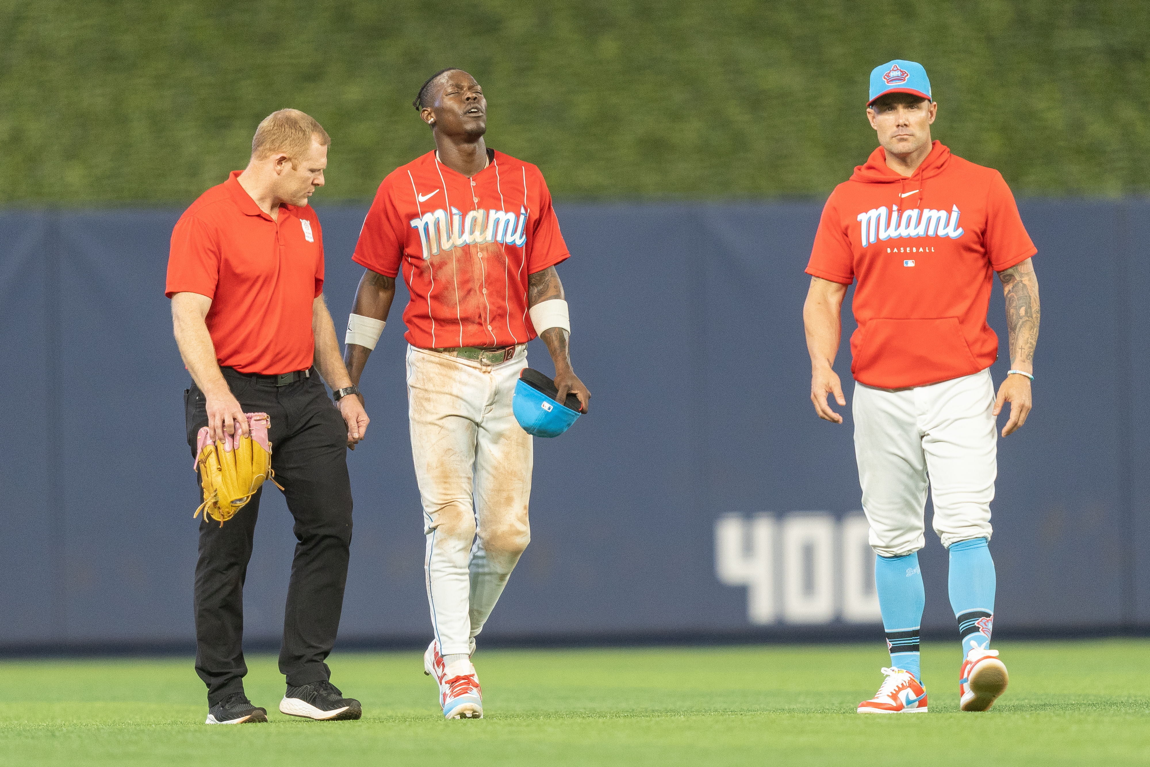 Jazz Chisholm Jr. #2 of the Miami Marlins walks off the field in the eighth inning after being injured during a play in the outfield against the Cincinnati Reds at loanDepot park on May 13, 2023 in Miami, Florida.