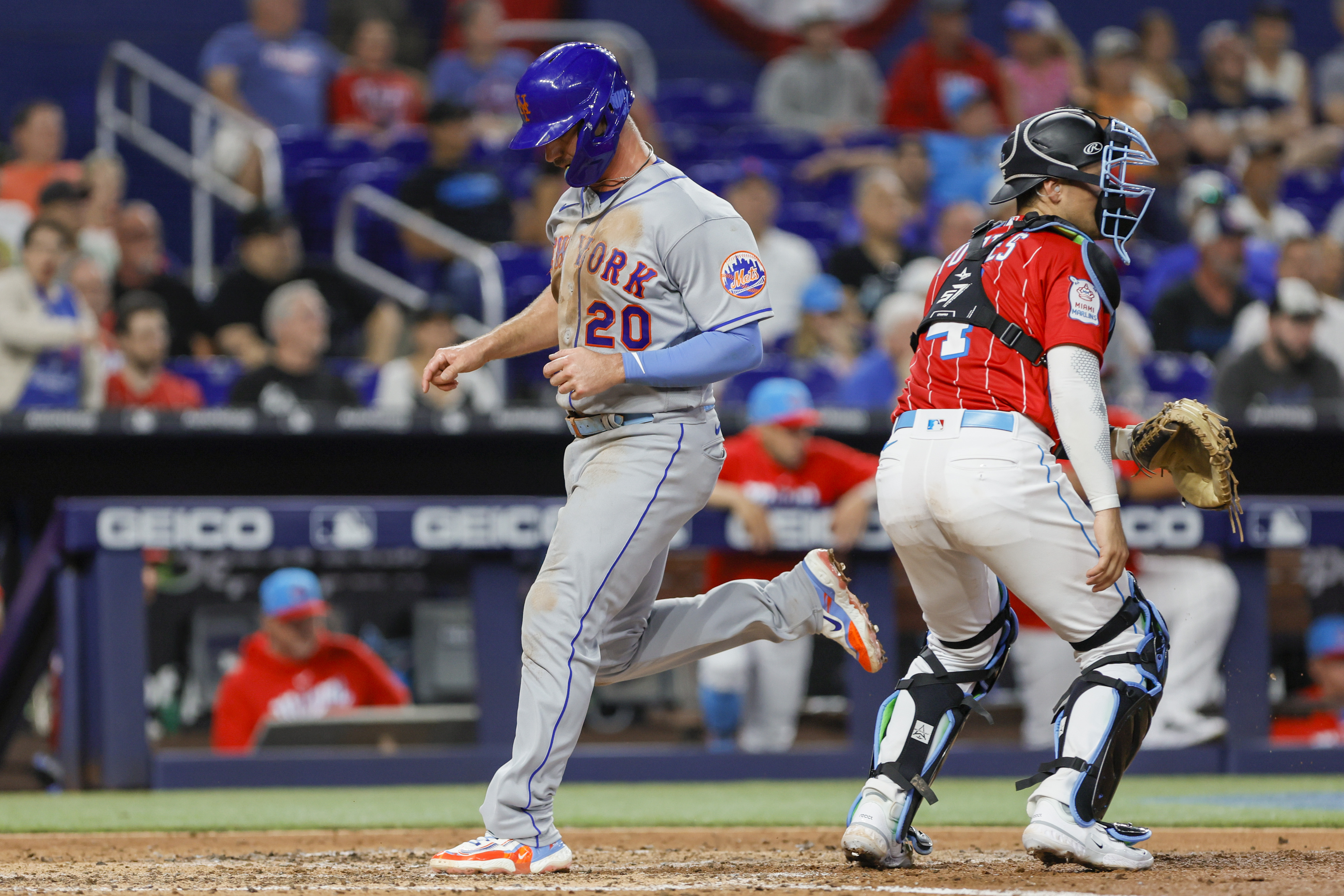 New York Mets first baseman Pete Alonso (20) scores after an RBI single from left fielder Mark Canha (not pictured) during the fifth inning against the Miami Marlins at loanDepot Park.