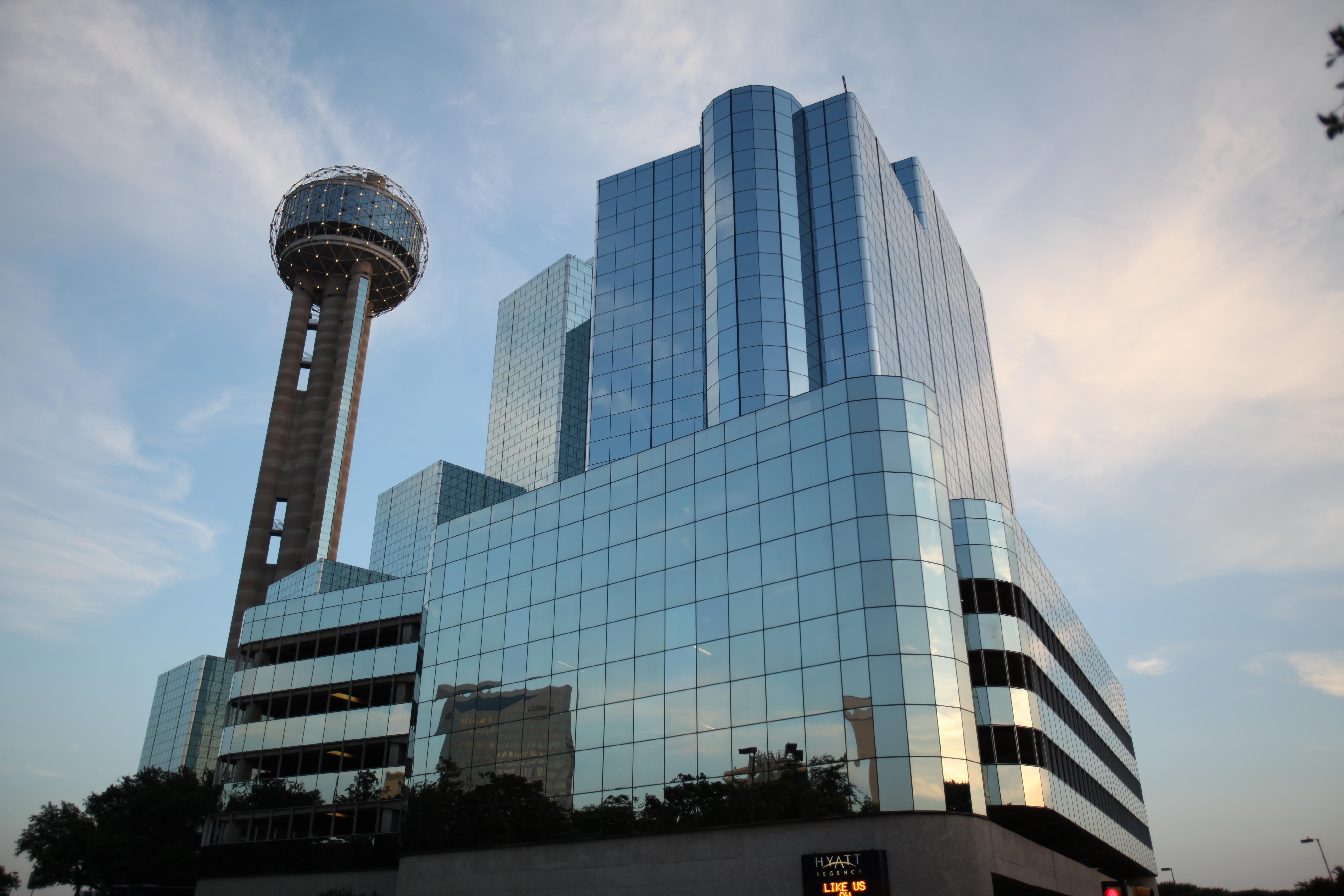 A daytime exterior shot of the Hyatt Hotel and Reunion Tower in Downtown Dallas.