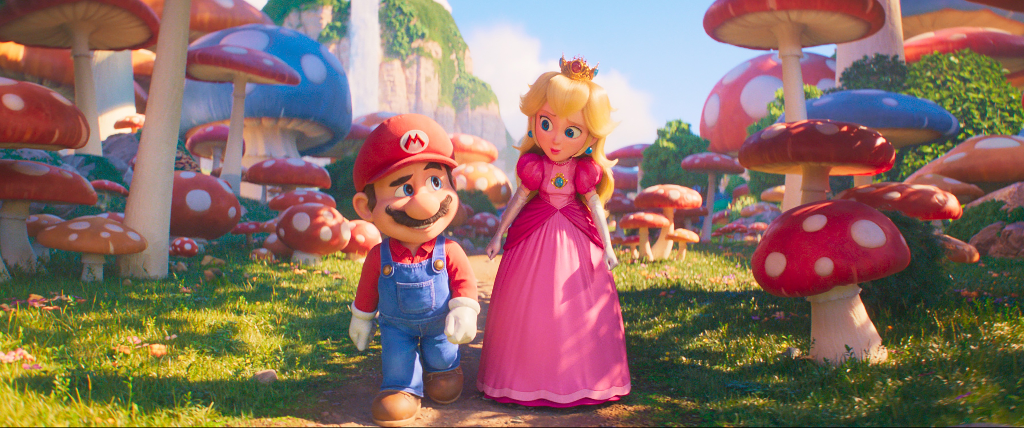 An image of Mario and Peach walking through a mushroom forest in the animated Mario movie. 