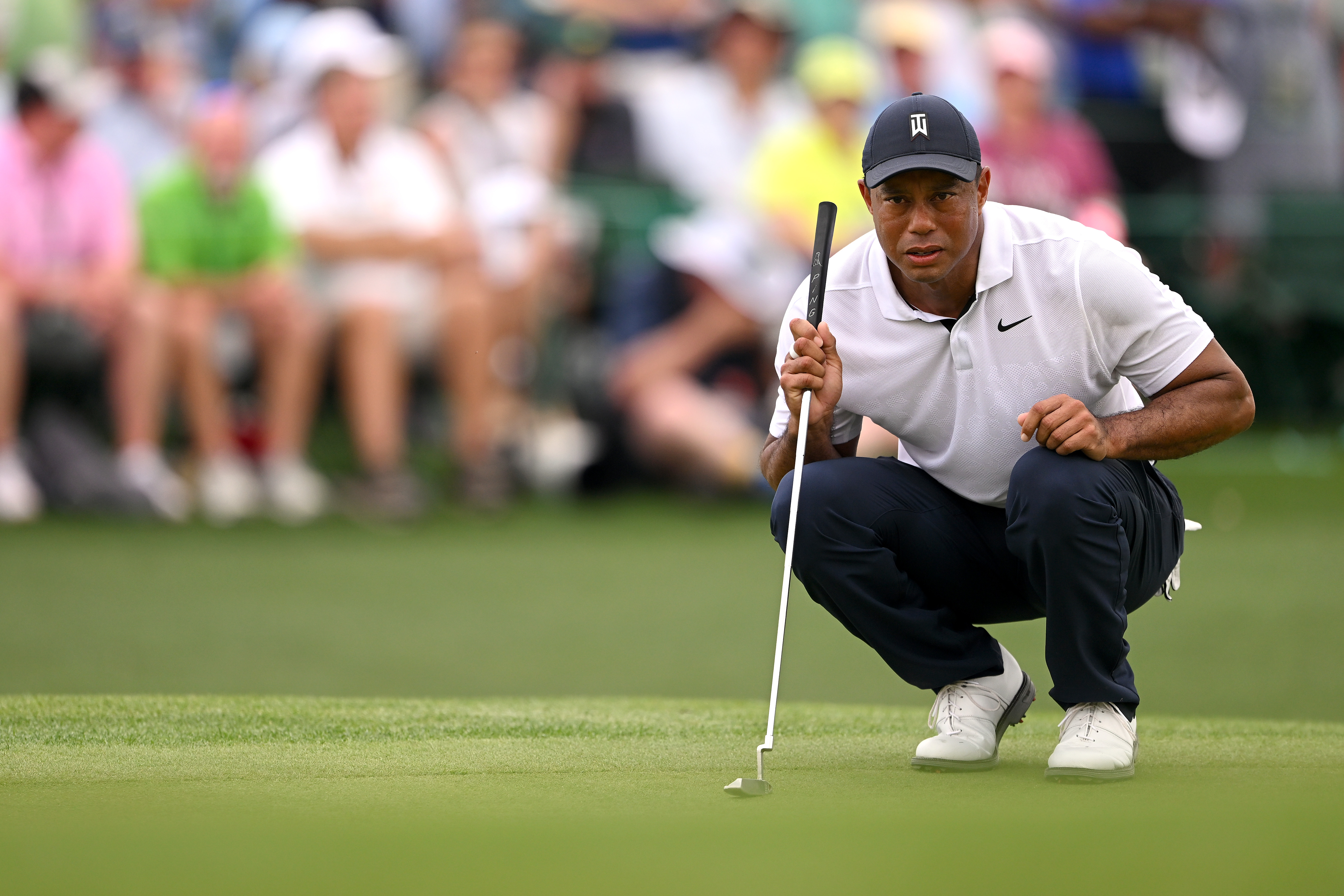 Tiger Woods of the United States lines up a putt on the 18th green during the first round of the 2023 Masters Tournament at Augusta National Golf Club on April 06, 2023 in Augusta, Georgia.