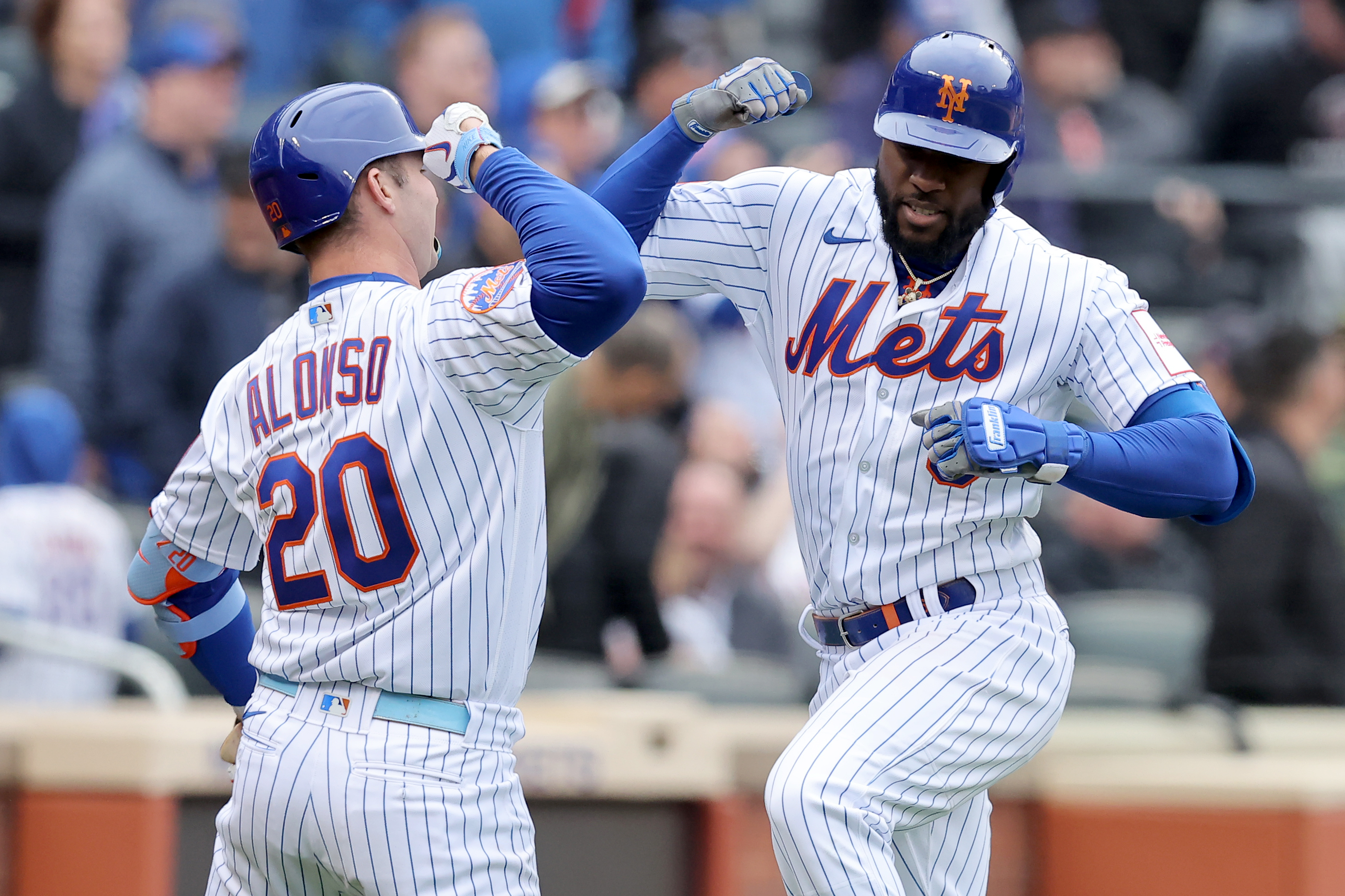 New York Mets right fielder Starling Marte (6) celebrates his solo home run against the Miami Marlins with first baseman Pete Alonso (20) during the sixth inning at Citi Field.