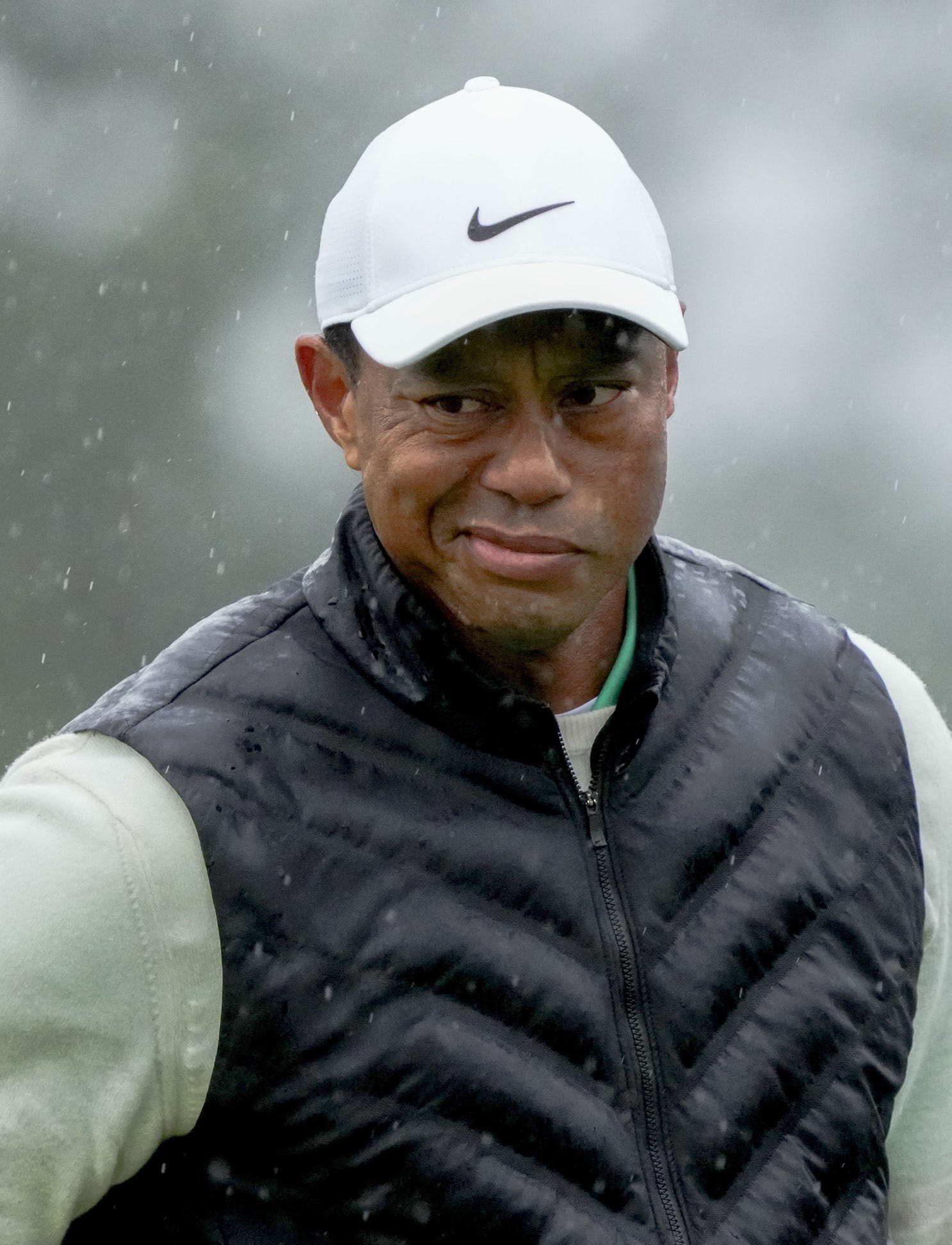 Tiger Woods reacts after putting on the 18th green during the second round of The Masters golf tournament.