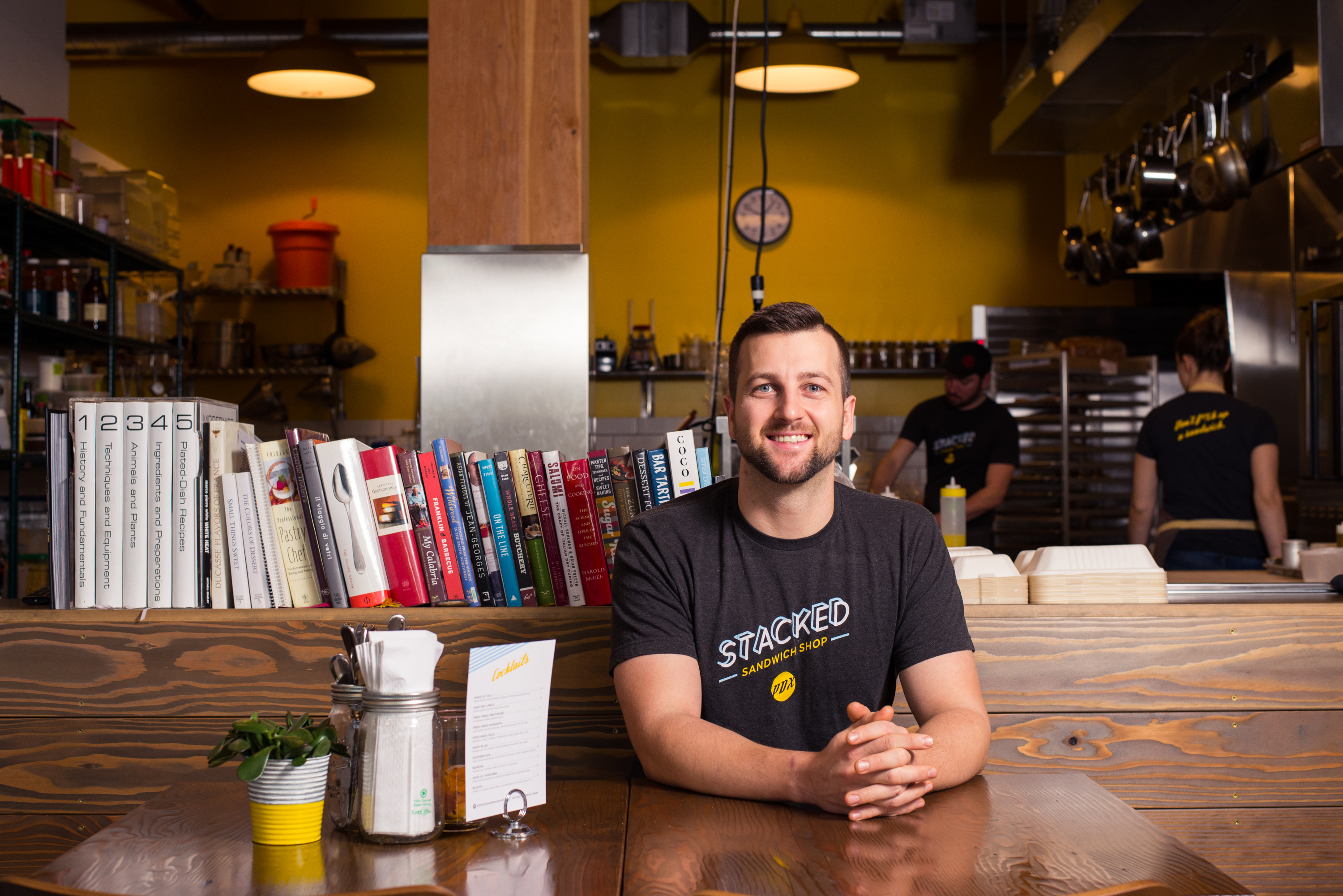 Top Chef alumnus Gabriel Pascuzzi sits at the counter of the now-closed location of Stacked Sandwich Shop.