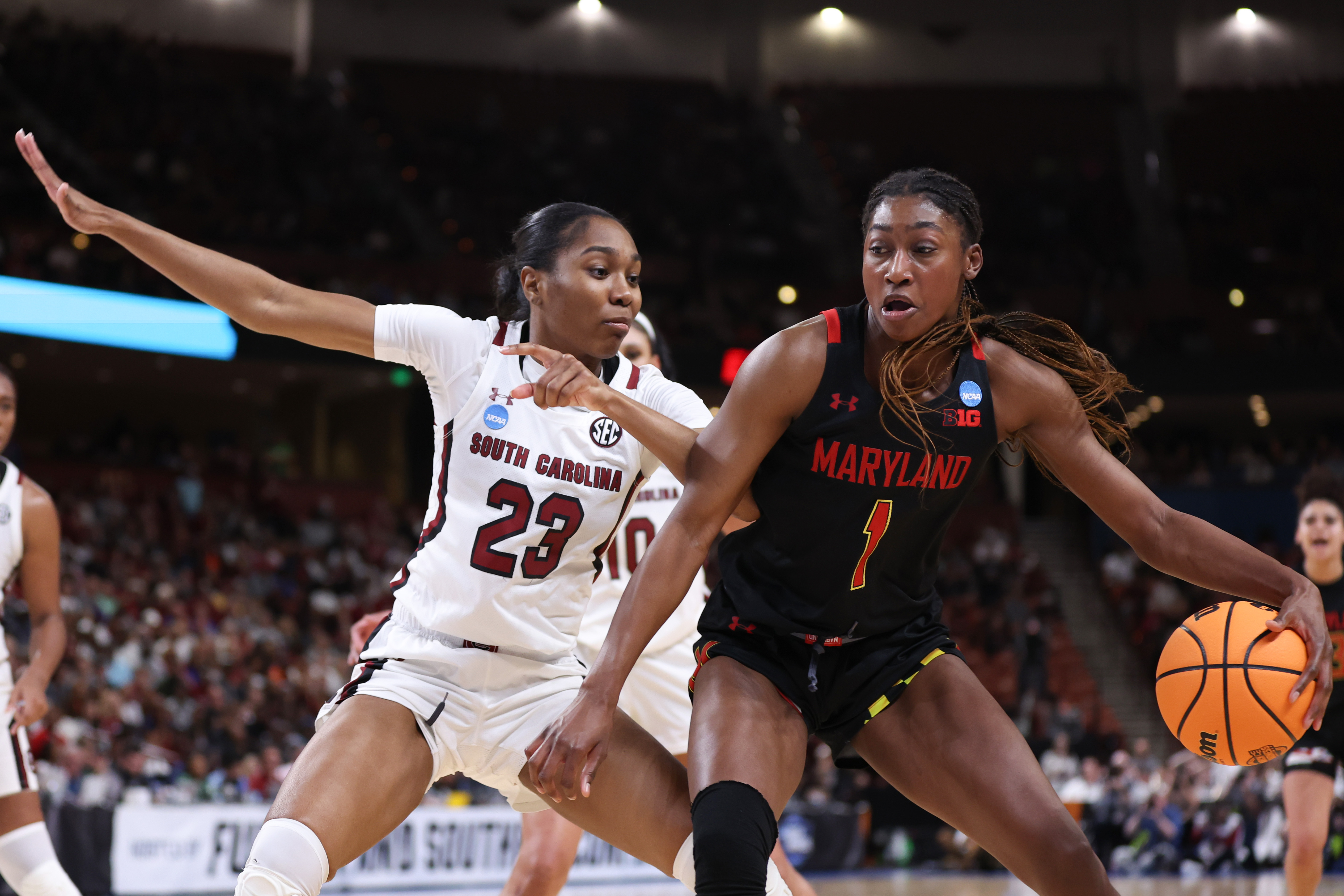 GREENVILLE, SOUTH CAROLINA - MARCH 27: Diamond Miller #1 of the Maryland Terrapins drives against Bree Hall #23 of the South Carolina Gamecocks during the third quarter in the Elite Eight round of the NCAA Women’s Basketball Tournament at Bon Secours Wellness Arena on March 27, 2023 in Greenville, South Carolina.