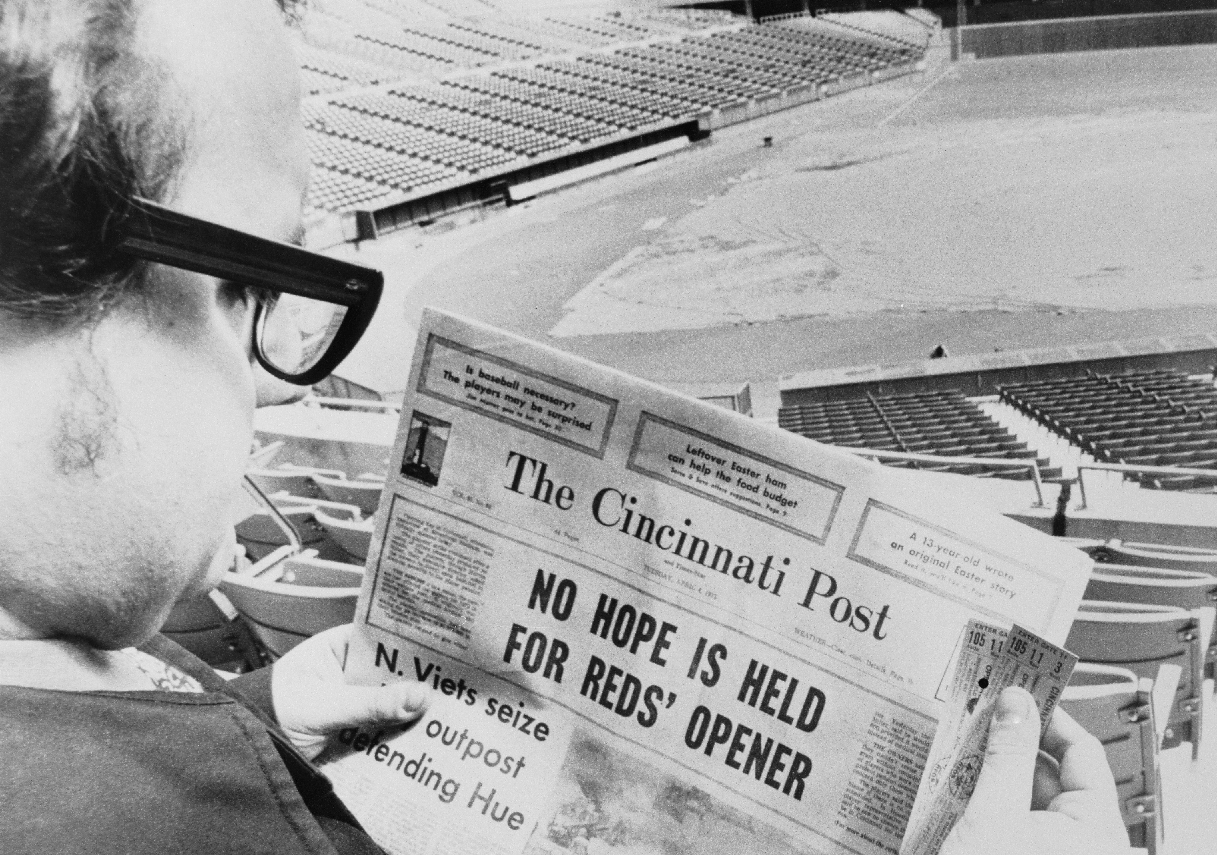 Lone Fan Reading The Cincinnati Post in Stadium