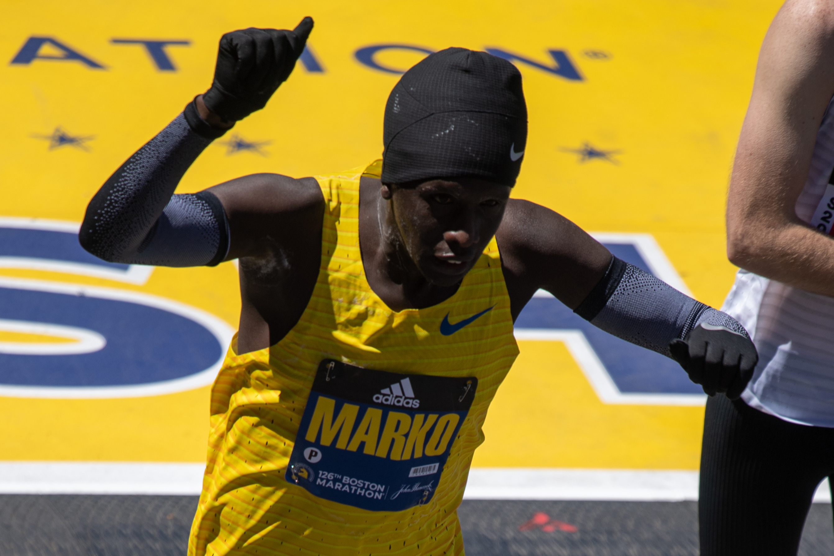 Marko Cheseto Lemtukei, of the United States, a double amputee, crosses the finish line in first place in the men’s Lower Limb Impairment division of the Boston Marathon on April 18, 2022 on Boylston Street in Boston, MA. Cheseto Lemtukei finished with a time of 2:37:01.