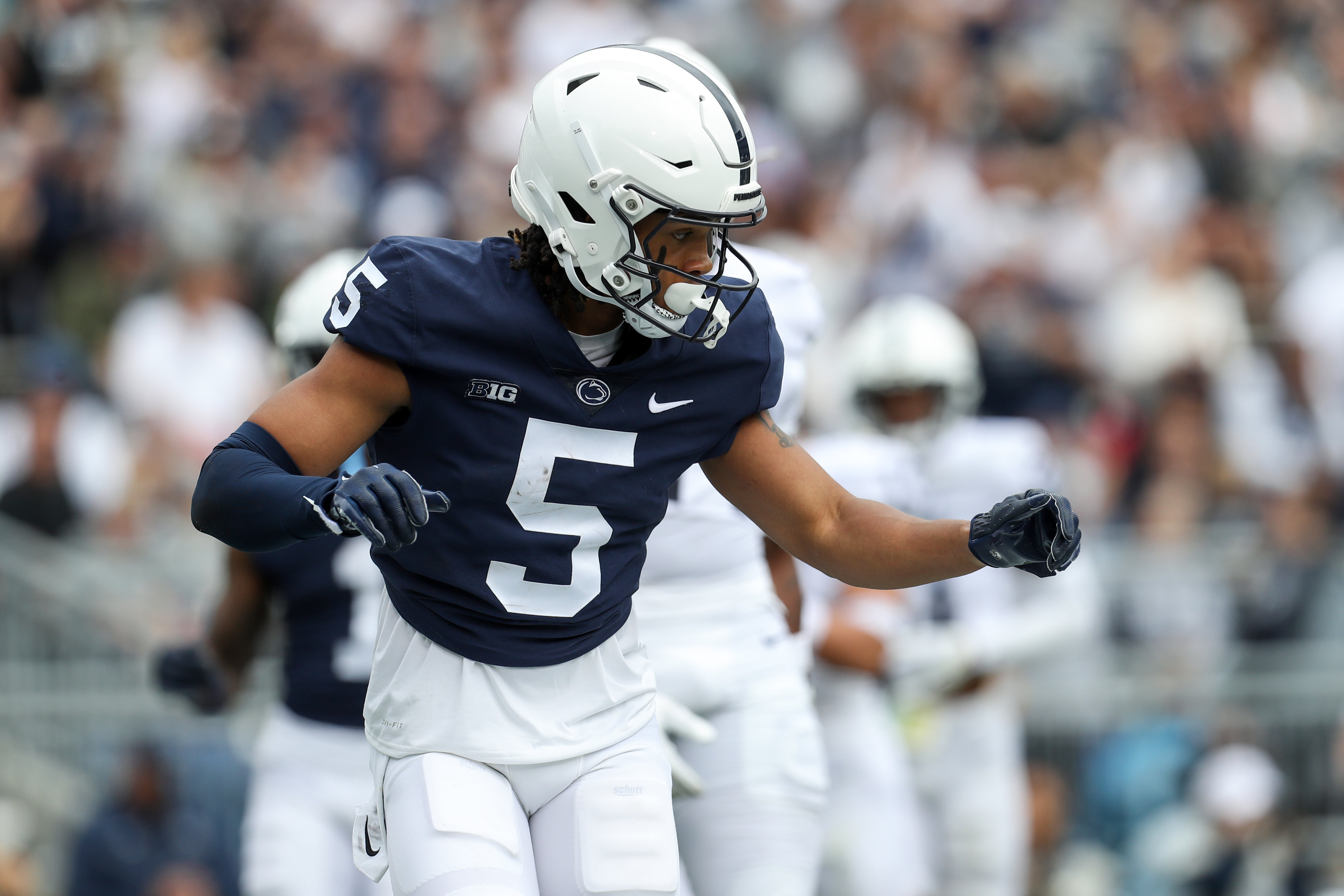 Apr 15, 2023; University Park, PA, USA; Penn State Nittany Lions wide receiver Omari Evans (5) celebrates after scoring a touchdown during the first quarter of the Blue White spring game at Beaver Stadium. The Blue team defeated the White team 10-0.
