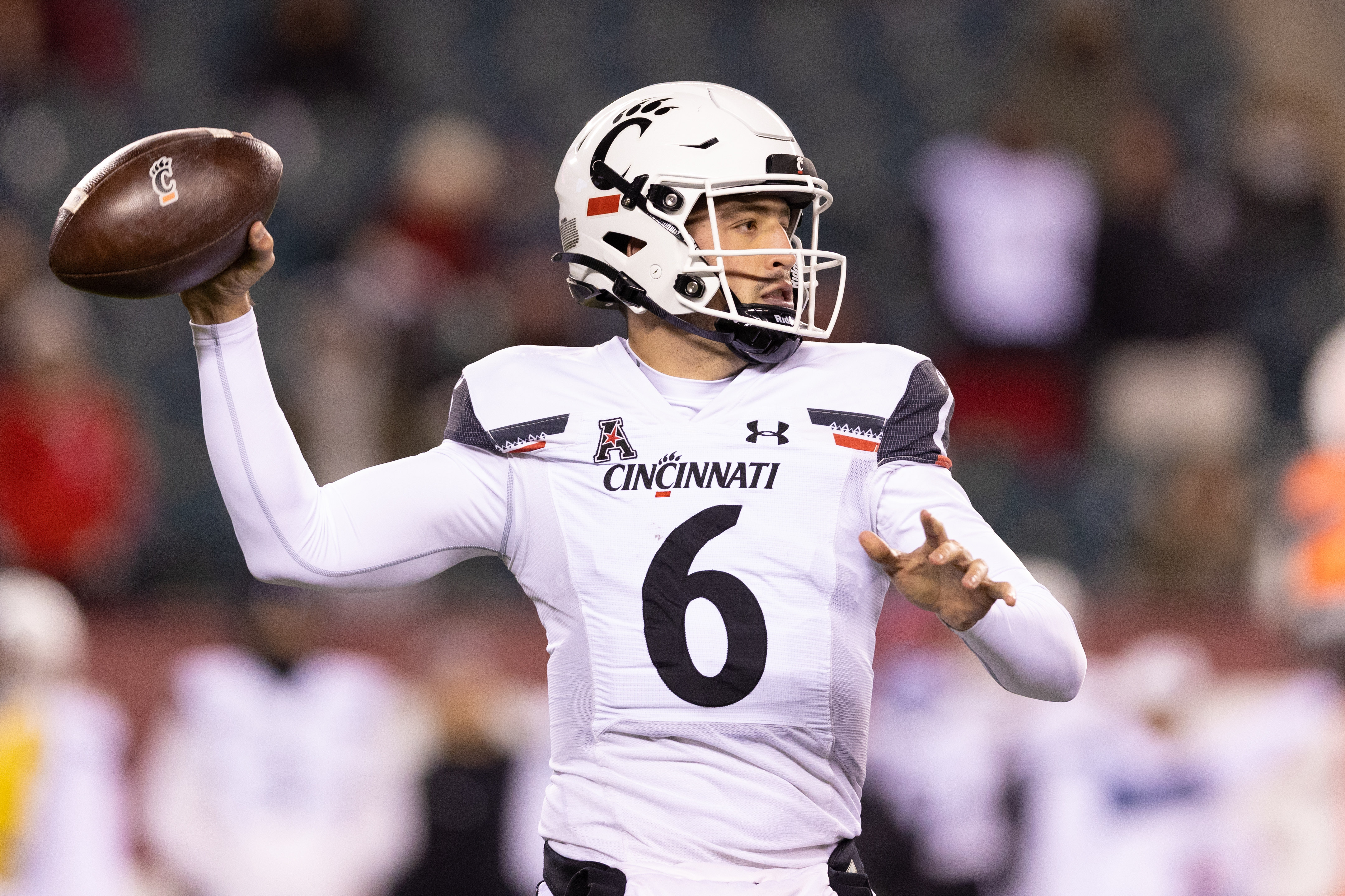 Cincinnati Bearcats quarterback Ben Bryant passes the ball against the Temple Owls during the second quarter at Lincoln Financial Field.