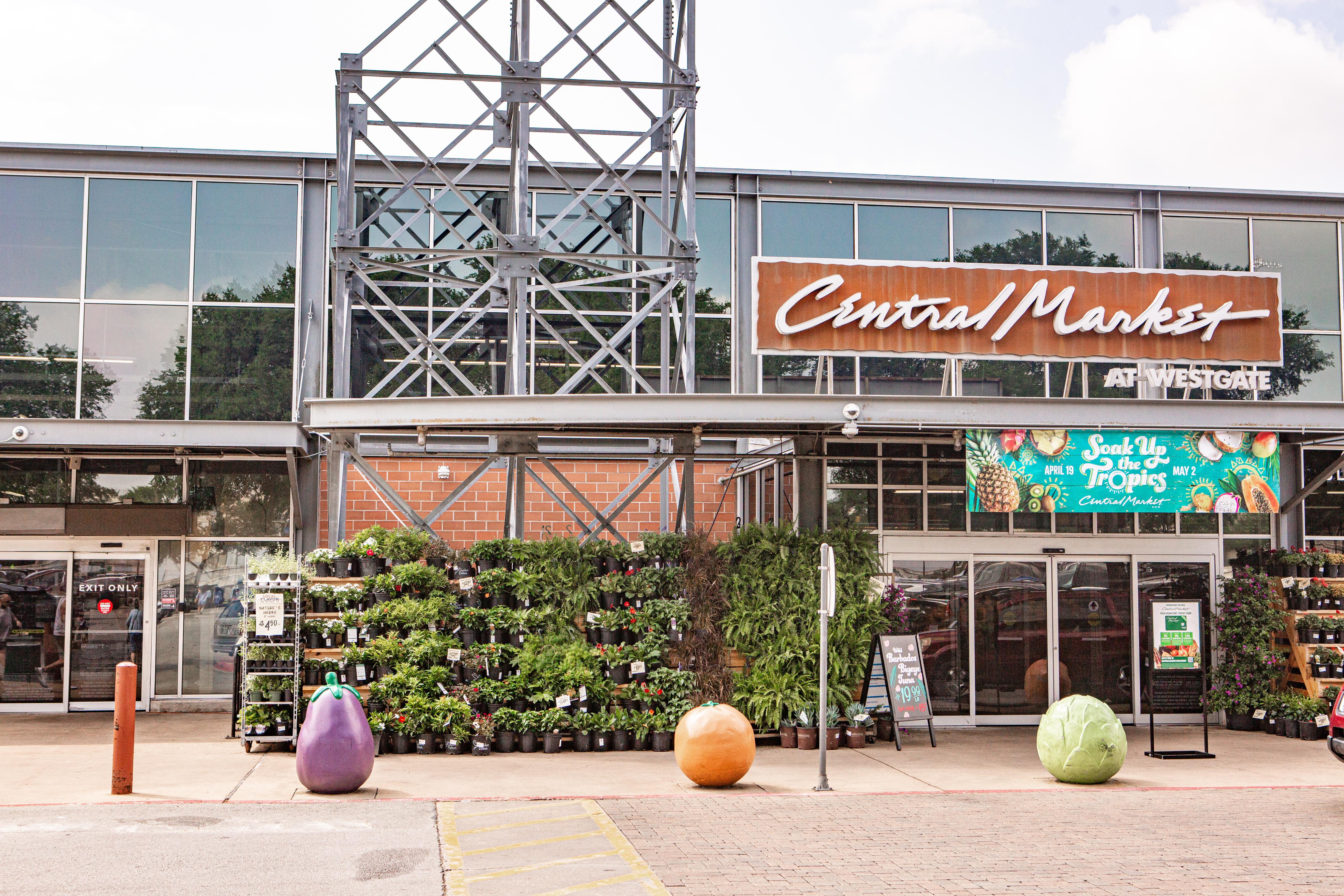 The front of a supermarket with the signage reading “Central Market.”