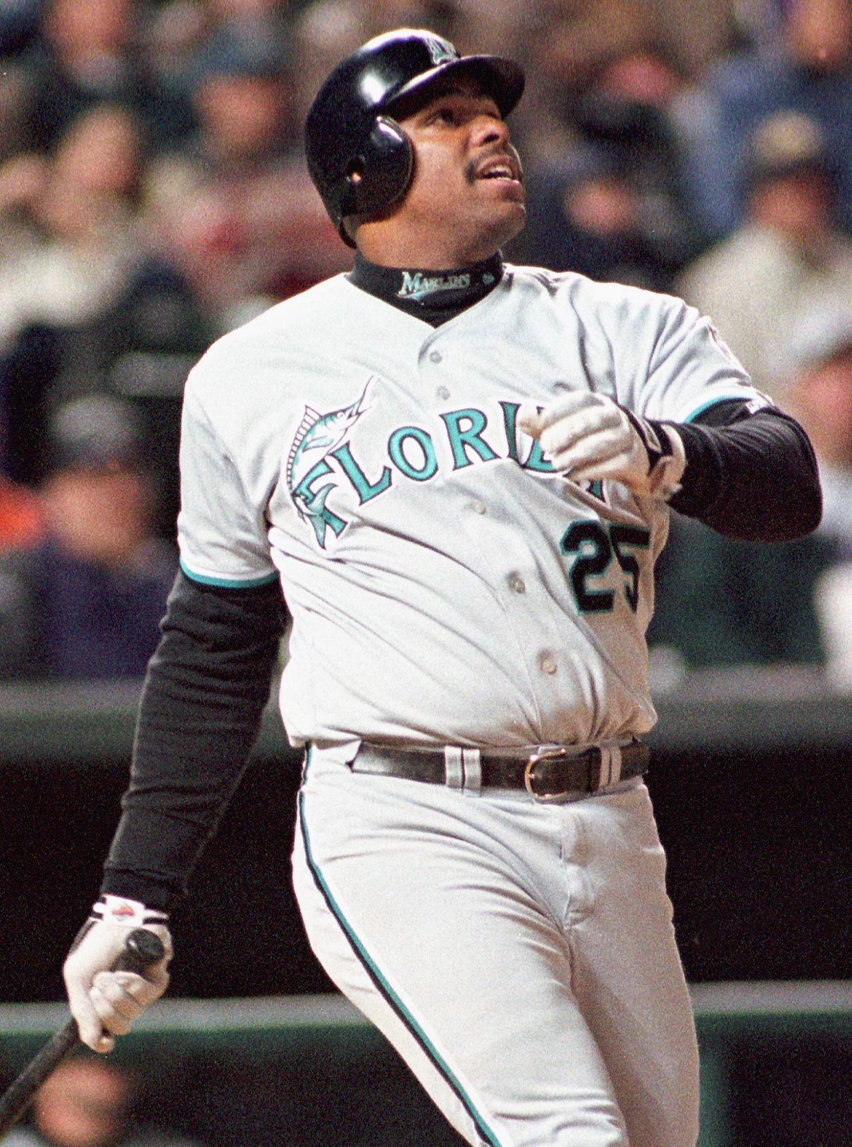 Florida Marlins Bobby Bonilla watches his game-winning solo home run sail over the outfield wall in the tenth inning against the Colorado Rockies 27 April at Coors Field in Denver, CO. The Marlins defeated the Rockies, 5-4.