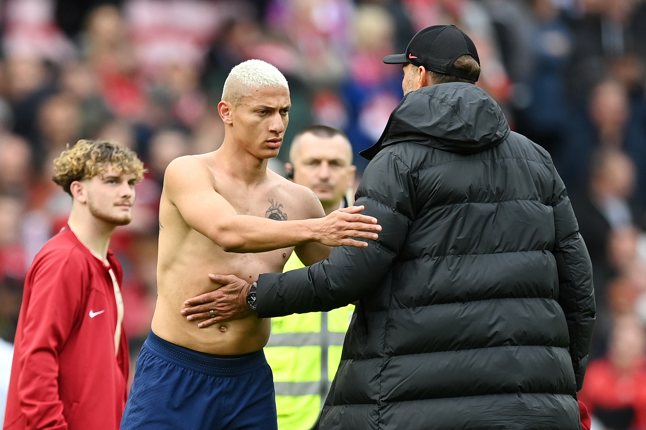 Richarlison of Tottenham Hotspur interacts with Juergen Klopp, Manager of Liverpool, after the Premier League match between Liverpool FC and Tottenham Hotspur at Anfield on April 30, 2023 in Liverpool, England.