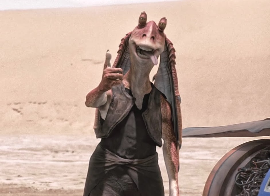 Jar Jar Binks gives a thumbs up with his tongue sticking out