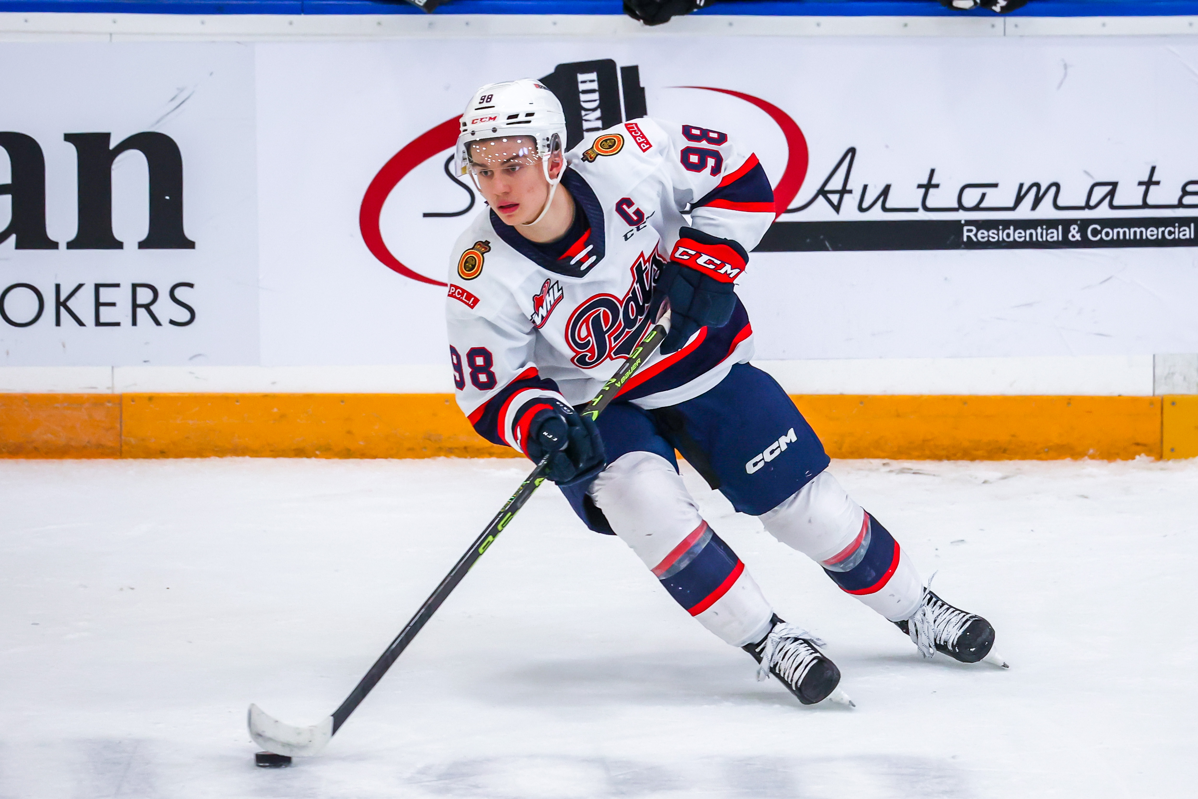 Connor Bedard of the Regina Pats plays the puck during third period action against the Winnipeg ICE at Wayne Fleming Arena on November 19, 2022 in Winnipeg, Manitoba, Canada.