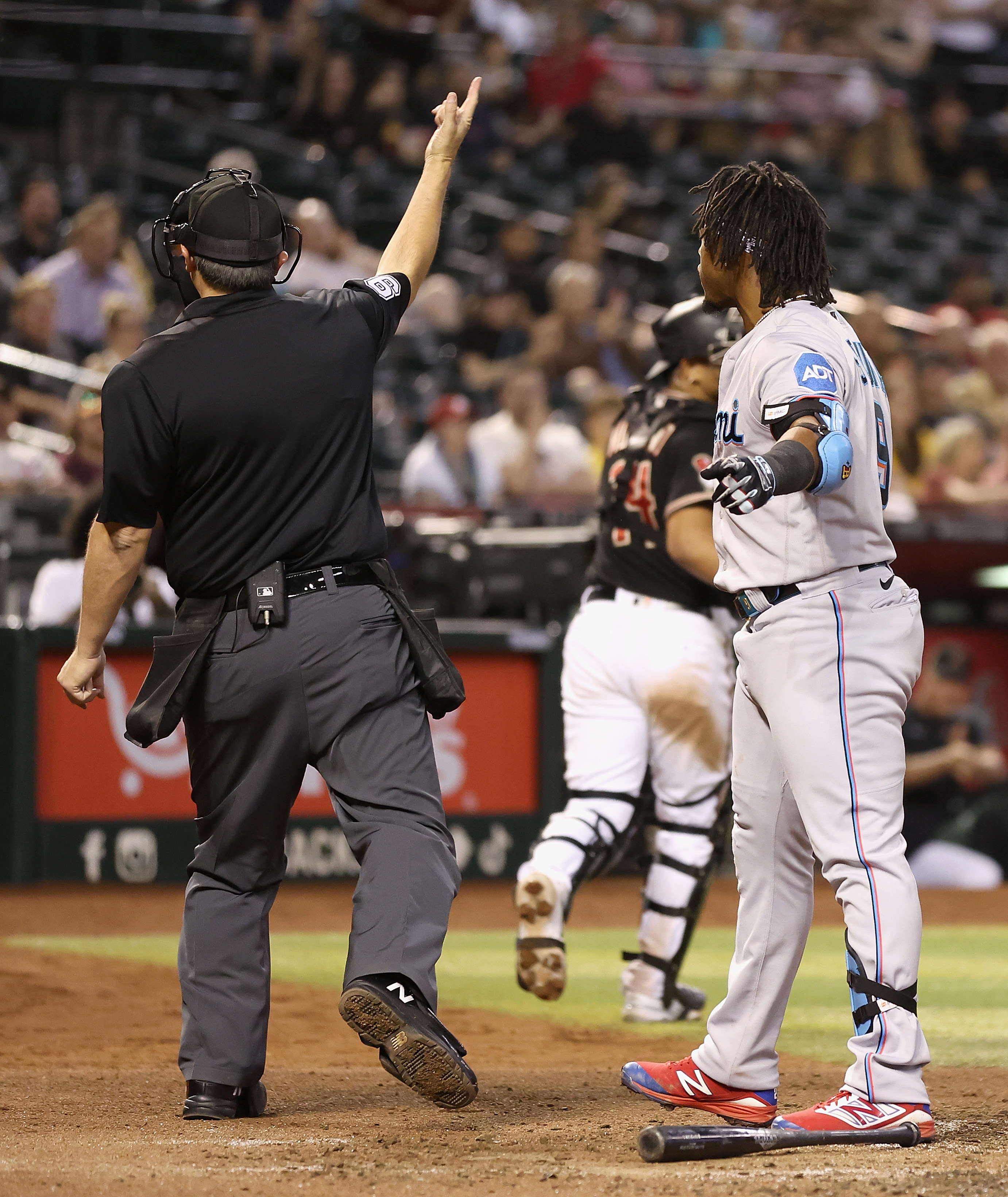 Jean Segura #9 of the Miami Marlins is ejected by home plate umpire Mark Ripperger #90 during the sixth inning of the MLB game against the Arizona Diamondbacks at Chase Field on May 08, 2023 in Phoenix, Arizona.