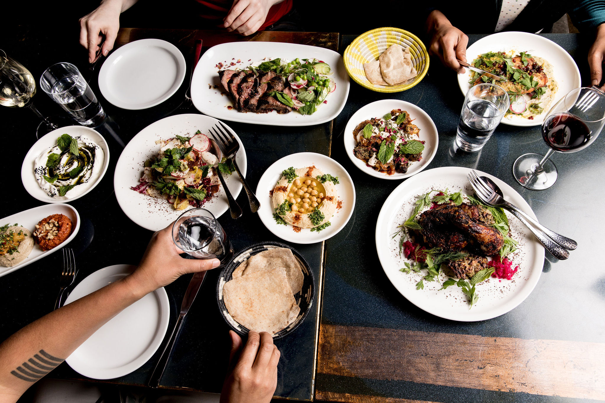 A table crowded with Mediterranean dishes